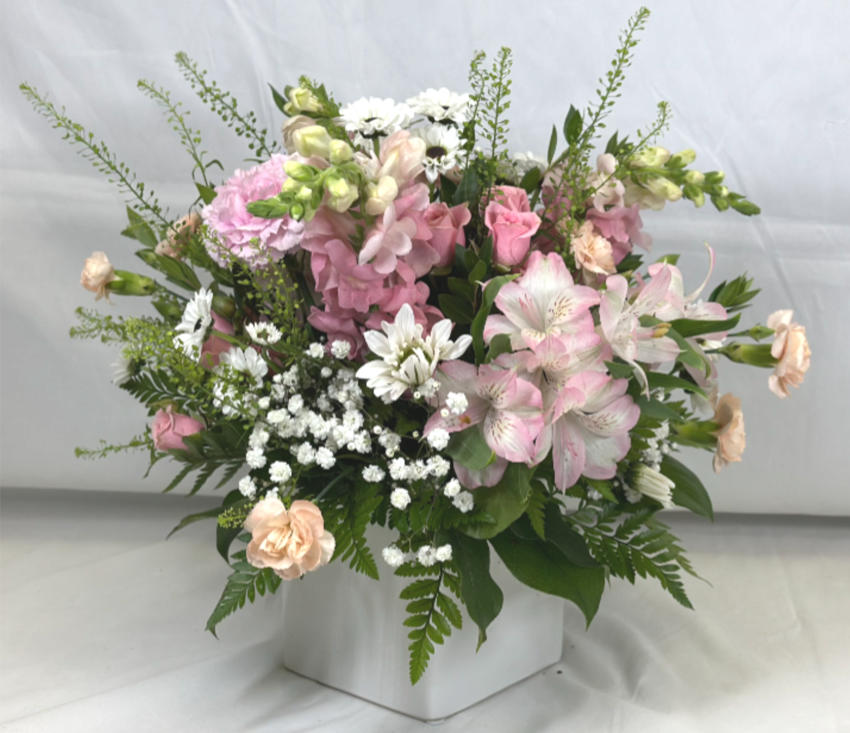 Soft Pink Posies - Lovely pink posies, with soft hues and gentle flowers are the hallmark of this piece, a Leary's Flowers exclusive.  If the featured flowers are unavailable we will design your arrangement using the freshest available blooms of equal or greater value