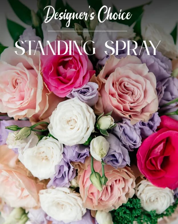 Standing spray of pink, white, and lavender roses with green accents