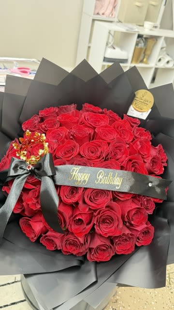 Red Rose Bouquet | Same Day Flower Delivery in Midland, TX - Make any birthday, anniversary, or romantic occasion unforgettable with our luxurious handcrafted red rose bouquet. Designed with premium Ecuadorian roses, elegant black wrapping, and a personalized ribbon, this bouquet is the perfect expression of love. 48 Roses