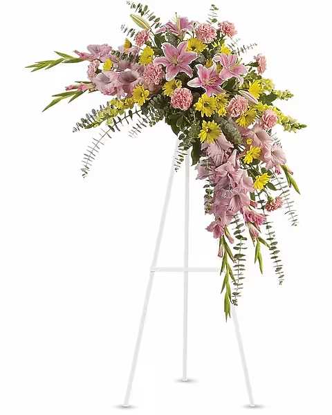 Sweet Solace Spray - Rejoice with this softly dramatic cascade of pink and yellow blooms - lilies, gladioli and chrysanthemums - that has hints of eucalyptus and variegated greens. Stems of flowers such as pink lilies, gladioli and carnations with yellow snapdragons, and daisy spray mums, accented by variegated greens and eucalyptus.  