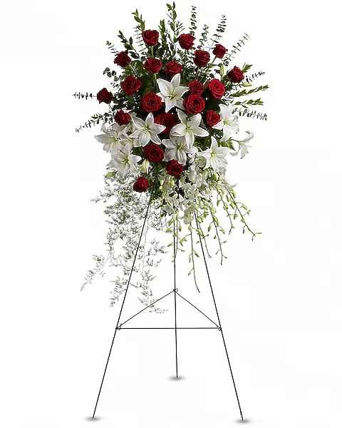 Lily and Rose Tribute Spray - Pure white lilies and dendrobium orchids mingle with red roses, white asiatic lilies and more in this magnificent and impressive standing spray of the finest blooms. A fitting tribute for a funeral, wake or memorial service. A standing spray of lush flowers such as red roses, white dendrobium orchids and asiatic lilies - accented with greenery - is delivered on an easel.