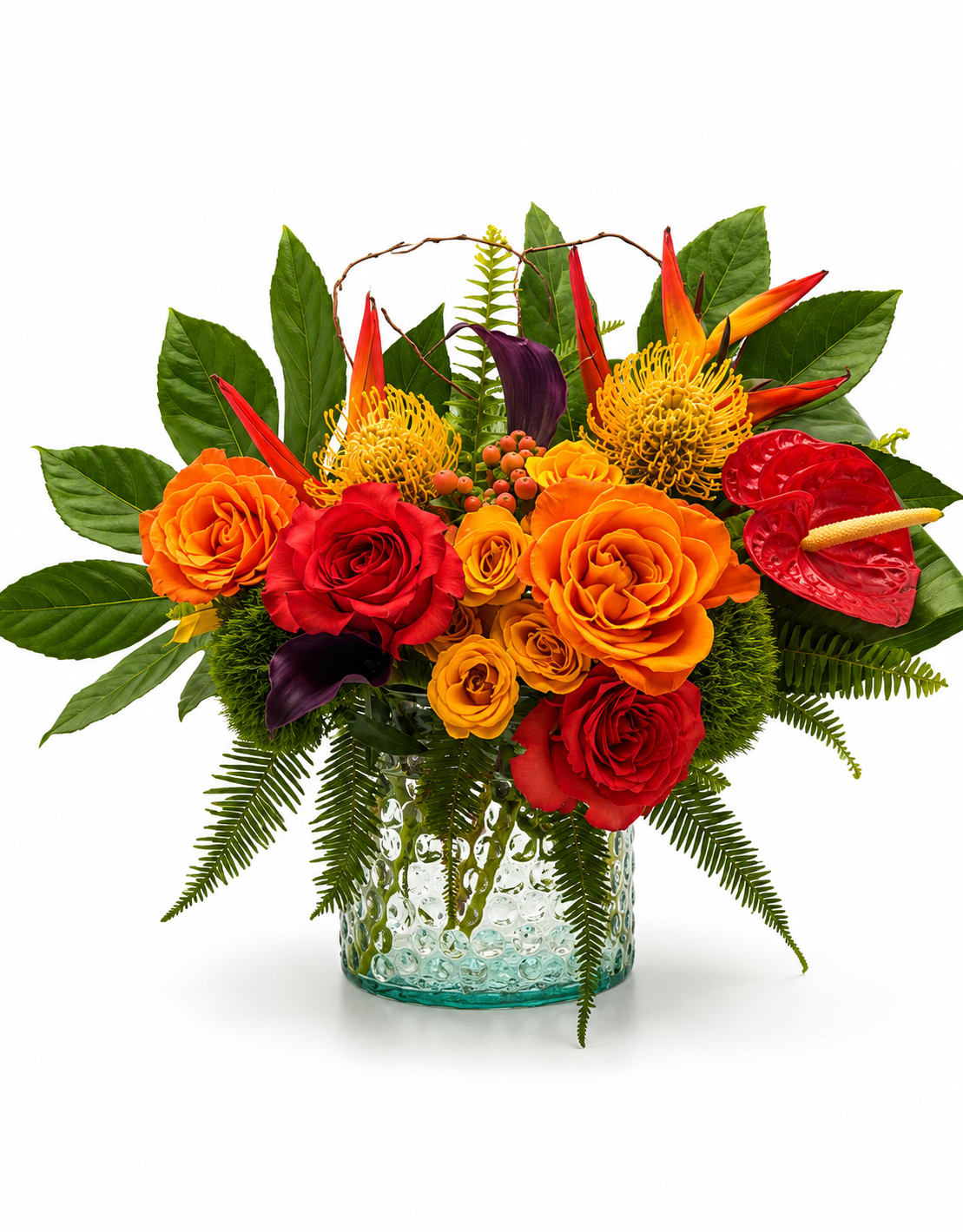     Tropical Fusion (V Signature™) - Experience the perfect harmony of tropical artistry and timeless elegance with Tropical Fusion™. This vibrant arrangement brings together striking Birds of Paradise, glossy red anthurium, premium roses, sculptural pincushion protea, elegant calla lilies, hypericum berries, and lush tropical foliage to create a bold, contemporary design full of texture and movement.  Rich shades of fiery orange, crimson red, golden yellow, and deep emerald green blend effortlessly to create a composition that’s both energetic and sophisticated. Natural curly willow adds an artistic finishing touch, giving the arrangement depth and modern character from every angle.  Handcrafted by the designers at Velvet Stems using the freshest premium blooms available, each arrangement is uniquely designed while remaining true to the overall style, color palette, and luxurious presentation shown.  Flower varieties may vary slightly based on seasonal availability while preserving the overall design, color palette, and luxurious tropical style.