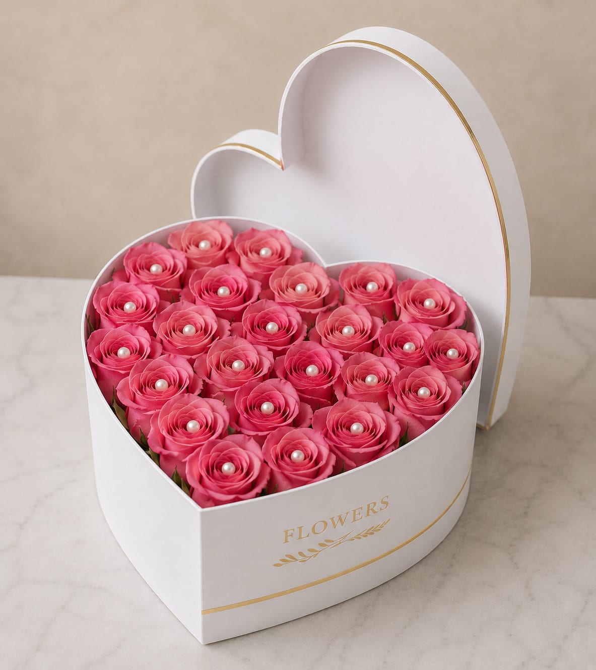 Blush Grace - Densely packed pink roses artfully arranged in a white heart-shaped box create an instant romantic statement-perfect as a Valentine's Day gift or anniversary surprise. The saturated pink blooms form a clean, keepsake-style presentation that reads like a handcrafted love note; the heart silhouette makes the sentiment unmistakable for the person you want to make feel cherished.  Each rose is finished with a delicate pearl-like accent at its center, and the white box (shown with a matching lid and subtle gold trim) becomes part of the display, so the whole arrangement feels polished and gift-ready. The compact, tightly grouped design emphasizes color and texture rather than loose foliage, offering a refined, feminine look that suits romantic occasions or to celebrate someone special.  This is the kind of keepsake floral box that makes her feel truly seen-romantic, elegant, and immediately shareable. Order as shown for a presentation-ready arrangement; the sturdy heart box also makes for an attractive memento once the roses have faded.