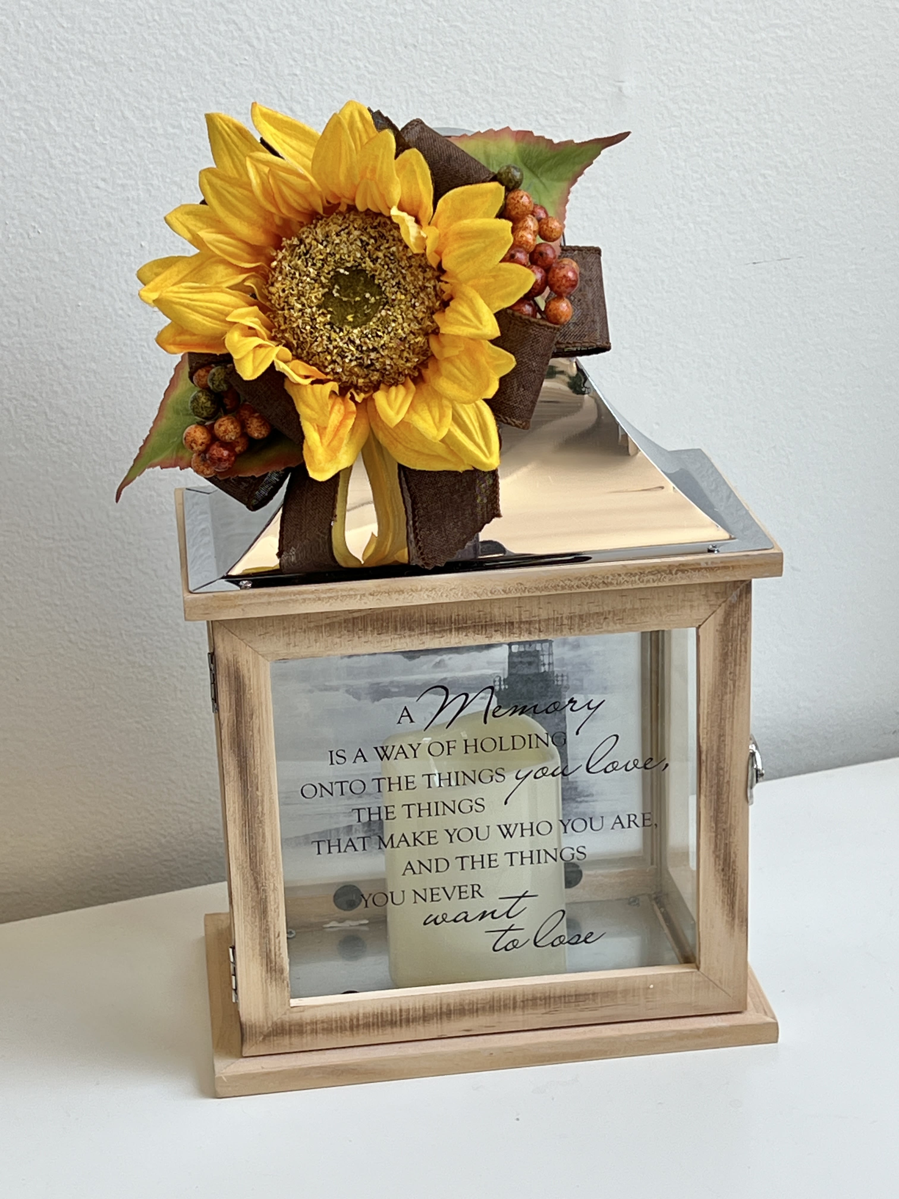 SYM-10 - Memory Lantern W/LED Flameless Candle - Can Be Customized W/Faux Flower Blossom.  Inscription says "A Memory is a Way of Holding Onto the Things You Love, the Things That make You Who You Are, and the Things You Never Want to Lose".