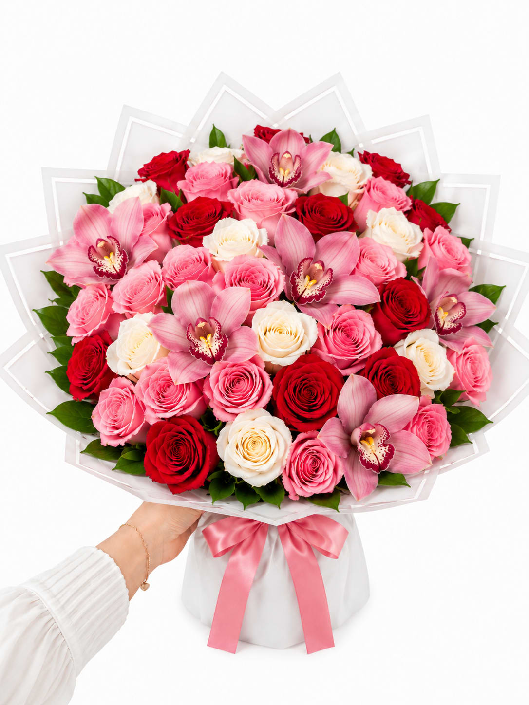 Blushing Romance Bouquet - Celebrate love, admiration, and life's most meaningful moments with our Blushing Romance Bouquet. This luxurious hand-tied arrangement features an elegant blend of premium red, blush pink, and ivory roses, beautifully complemented by exquisite pink cymbidium orchids. Wrapped in sophisticated white Korean-style waterproof paper and finished with a soft pink satin ribbon, this bouquet offers a modern yet timeless presentation.  Perfect for anniversaries, birthdays, Valentine's Day, Mother's Day, or simply expressing heartfelt emotions, this stunning bouquet is designed to leave a lasting impression. Every stem is carefully selected for freshness and artistry, creating a full, lush arrangement that radiates elegance and romance.  Premium red, blush pink, and ivory roses Fresh pink cymbidium orchids Lush seasonal greenery Luxury white Korean wrapping Finished with a pink satin ribbon Handcrafted by expert floral designers