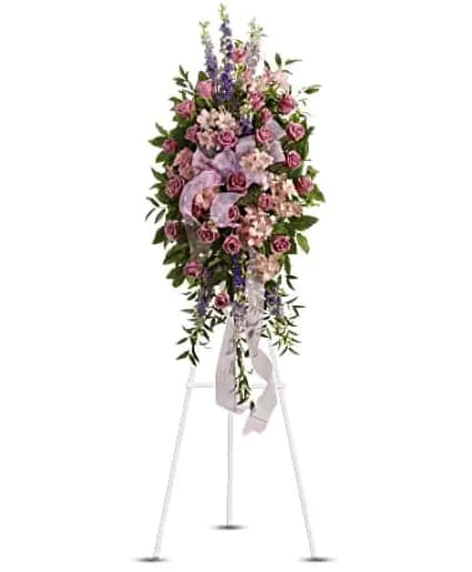 Finest Farewell Sympathy Flowers - This abundant spray of soft, feminine spring colors feels as calming as a walk in the countryside. Sheer organza ribbon is threaded through lavender, purple and pink blooms that are accented by trailing greens. - Includes soothing flowers such as lavender roses and larkspur, plus pink alstroemeria.