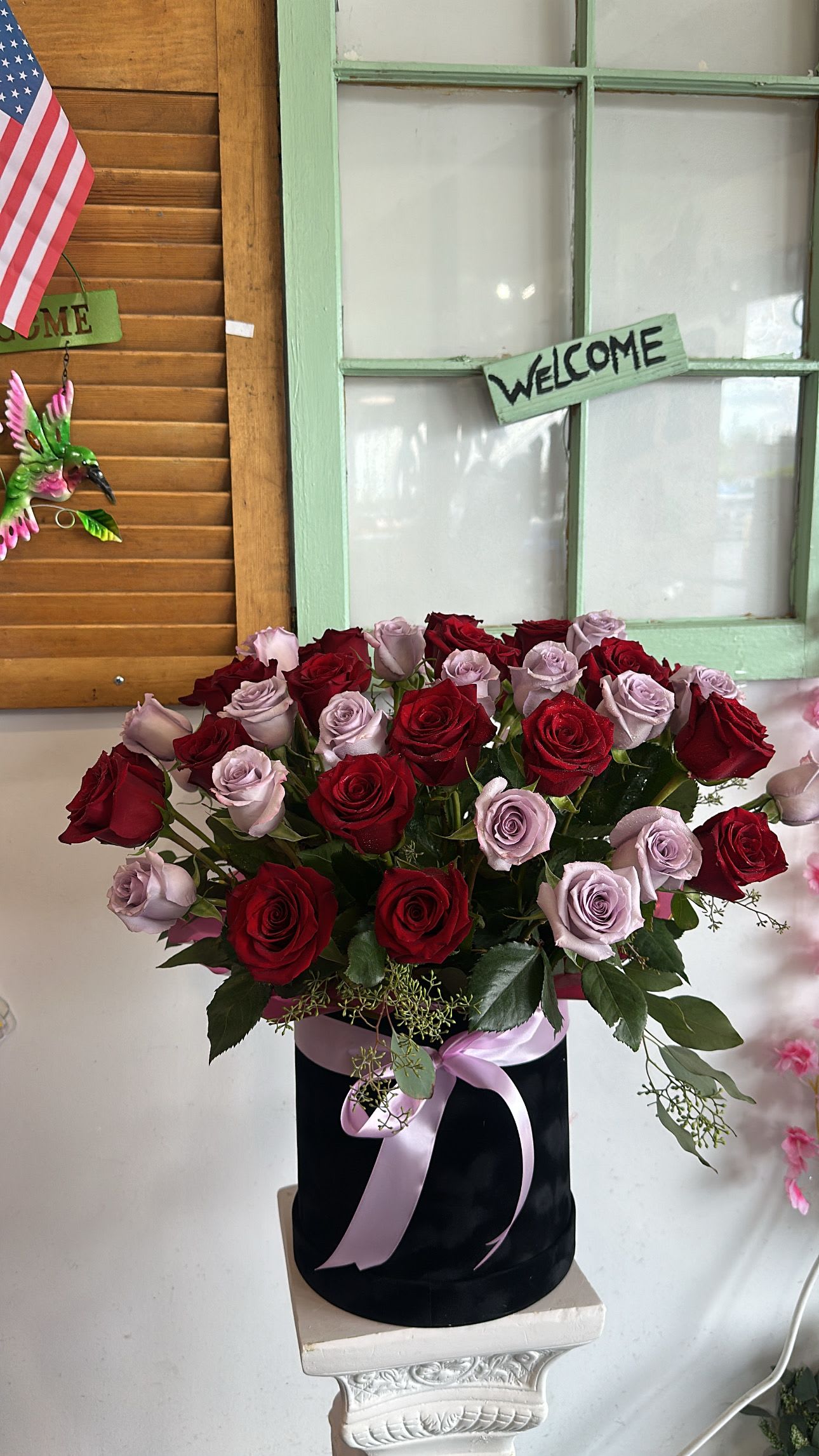 Red &amp; Lavender Rose box  -  A luxurious blend of 40  premium red and lavender roses, beautifully arranged in a sleek black hat box and finished with a delicate satin ribbon. This timeless design combines romance and elegance, making it perfect for anniversaries,Red