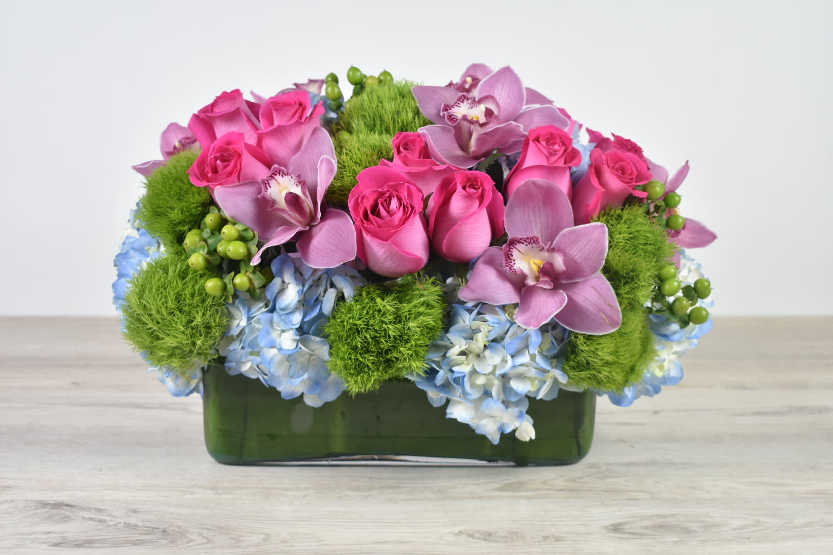 Sweet and unique - This Sweet and Unique floral design come in a glass rectangular Vase  With some beautiful blue hydrangeas, Pink Rose, Pink Cymbidium orchids and a touch of green dianthus   Perfect for  birthday flowers anniversary flower  just because flowers  congratulations flowers  Get well flowers  Christmas flowers Valentines Day flowers Mother's Day flowers 