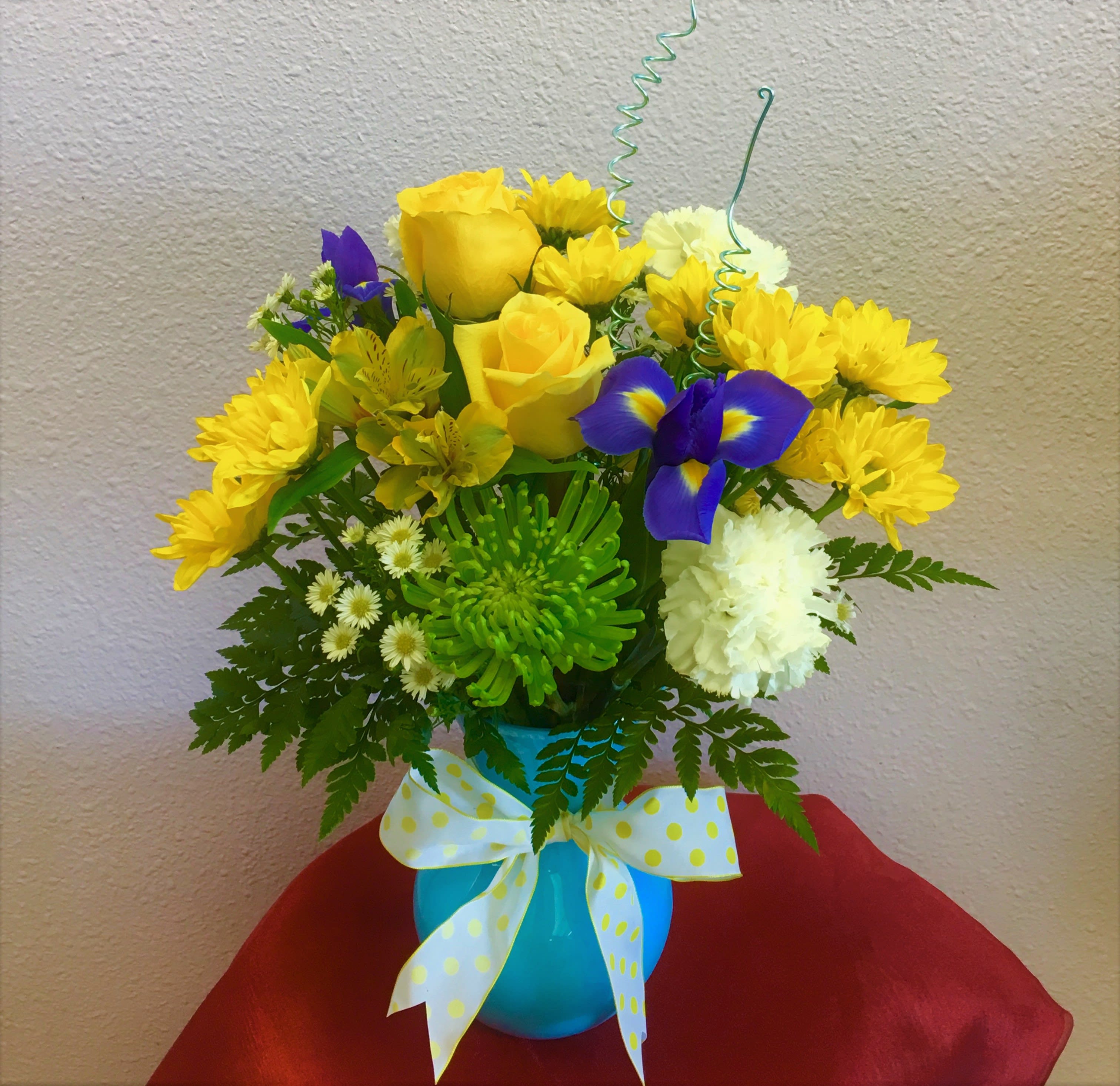 Baby Boy by Forever Flowers - A blue and yellow arrangement suitable for newborns, baby showers, &amp; other occasions. Contains daisies, irises, roses, etc..
