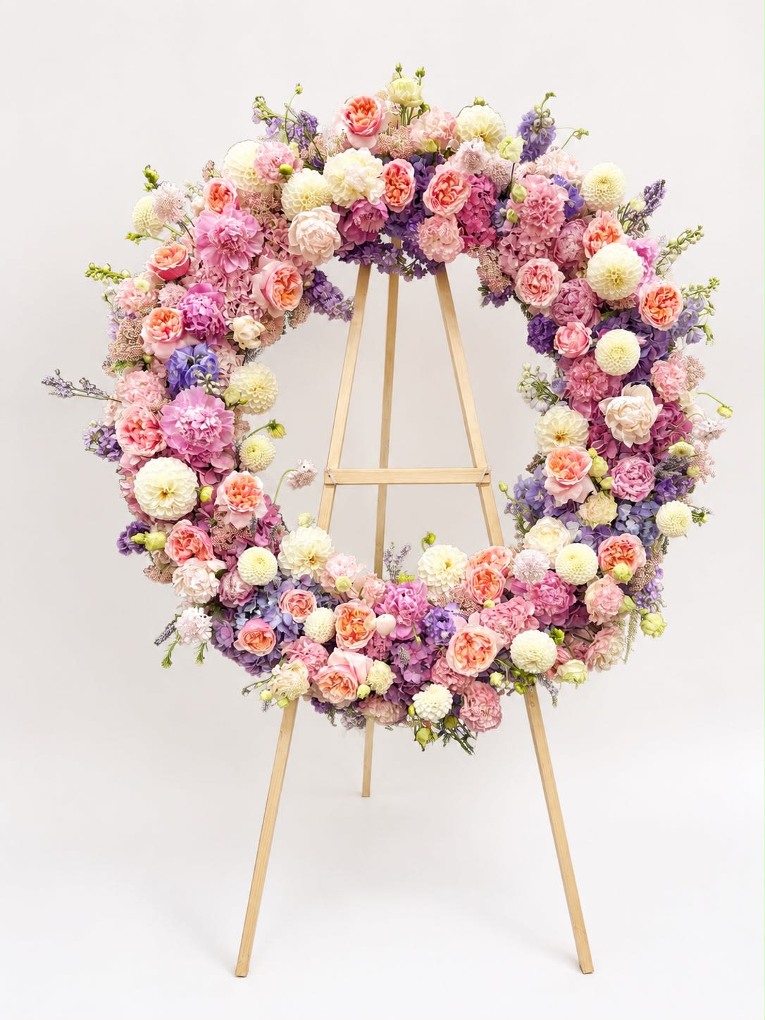 Luxury Floral Wreath - A lush garden-style floral wreath handcrafted with premium fresh flowers, designed to create an elegant statement for weddings, celebrations, memorials, and special events
