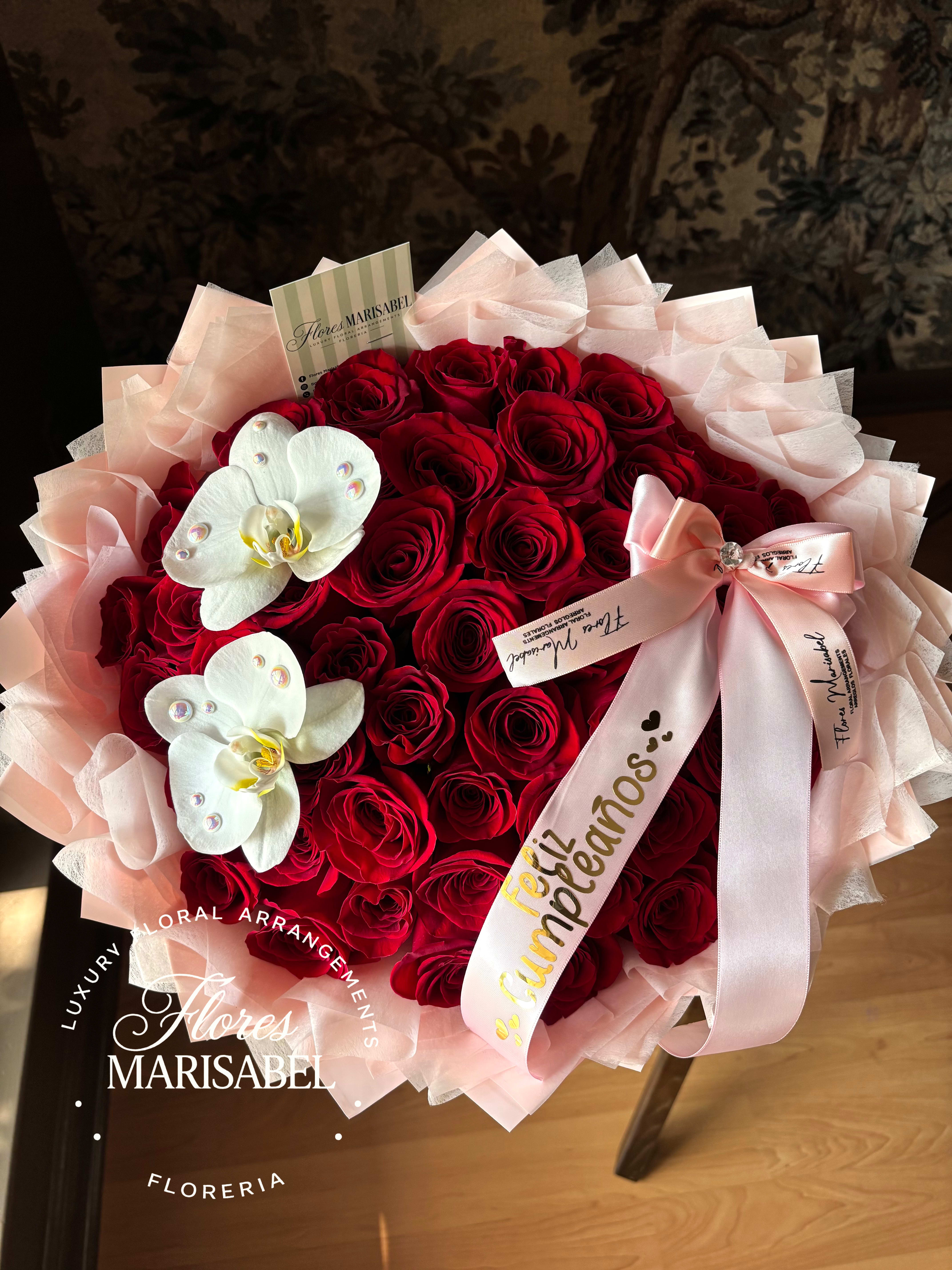 50 red roses with orchid flowers  - 50 red roses with 2 orchid flowers. Layered wrap. Ribbon not included. 