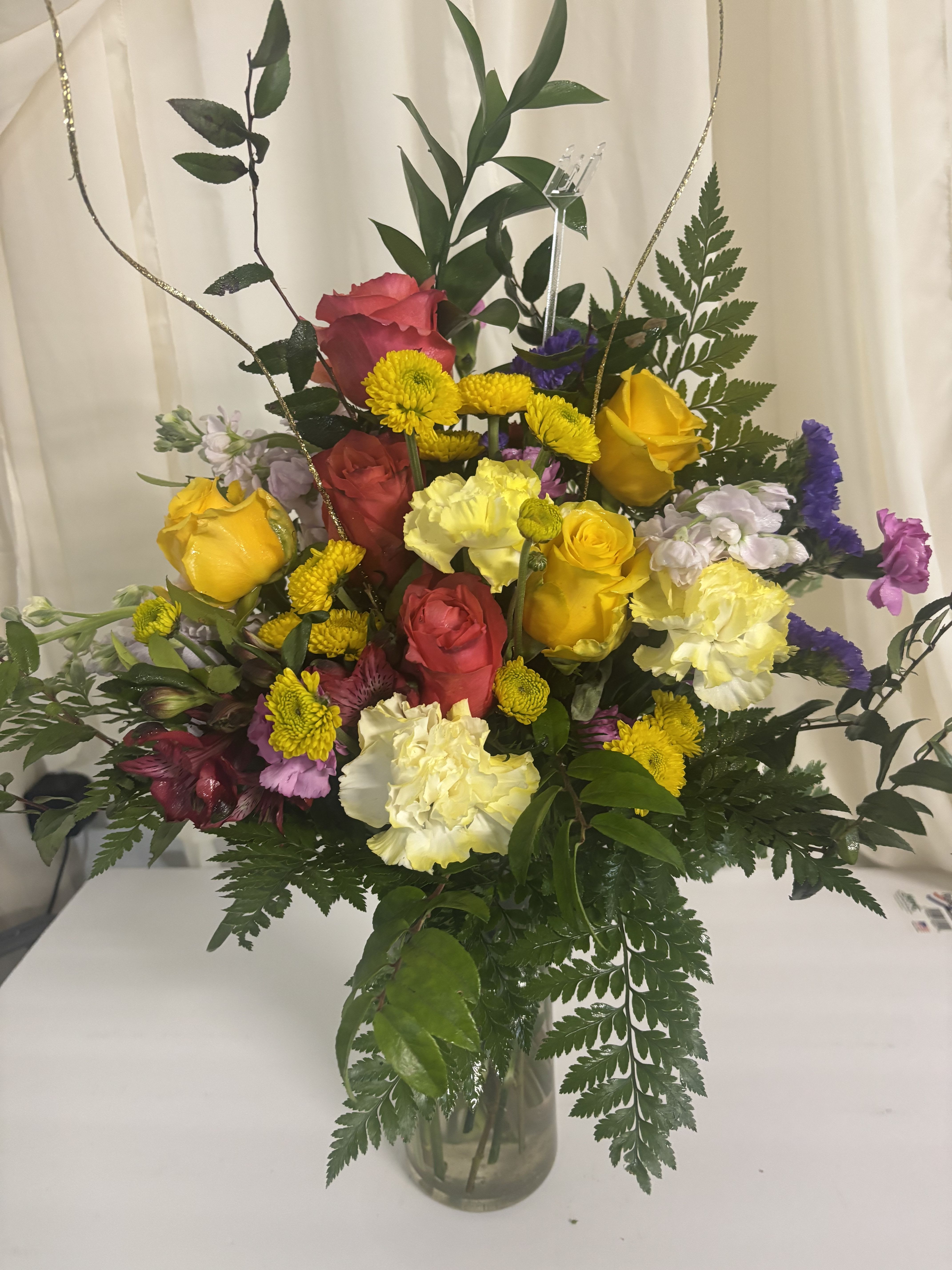 Walking On Sunshine  - Sunlit yellow and pink roses take center stage in this joyful flower arrangement, perfect as a birthday bouquet, thank-you gift, or any cheerful celebratory occasion. Walking On Sunshine blends bright warmth with soft pastels so the person you're thinking of will feel noticed and uplifted the moment it arrives.