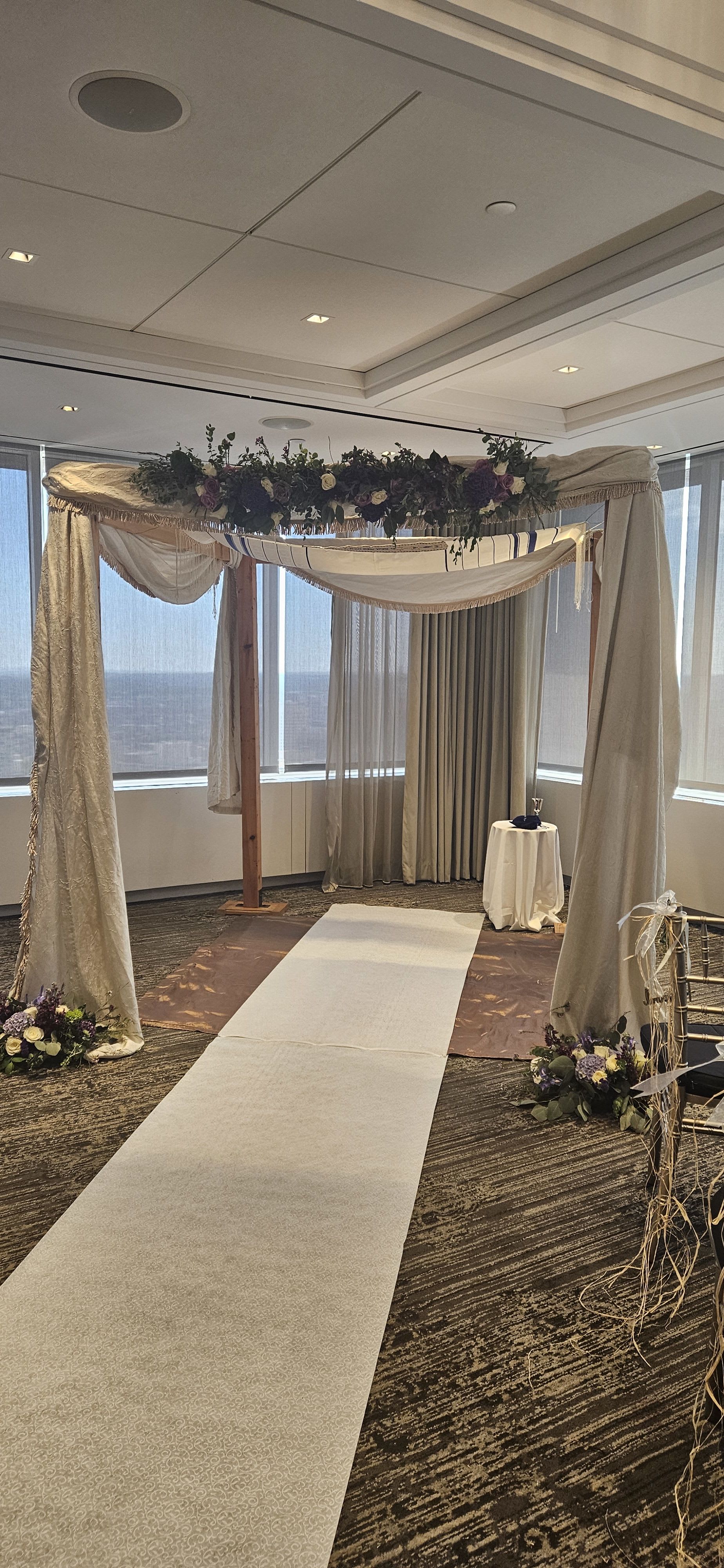 arbor  - florals and greens woven around said structure