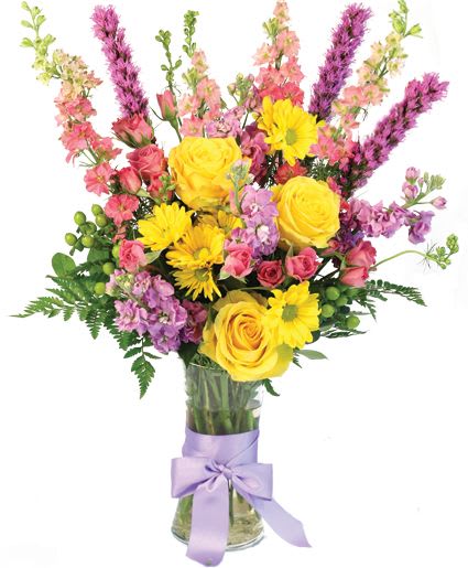 Pastel Delight Bouquet - Pastels have never looked so fetching! The flawless yellow daisies and roses pair perfectly with the beautiful pink larkspur, purple Liatris, lavender spray roses, and more, making Pastel Delight a dreamy and alluring mix. Bring some joy and color to any room or occasion with this stunning bouquet!  Includes: Gathering Vase, Ribbon, Foliage: Salal , Leather Leaf, Pink Larkspur, Purple Liatris, Yellow Daisies, Pink Spray Roses, Yellow Roses, Green Hypericum, Lavender Stock