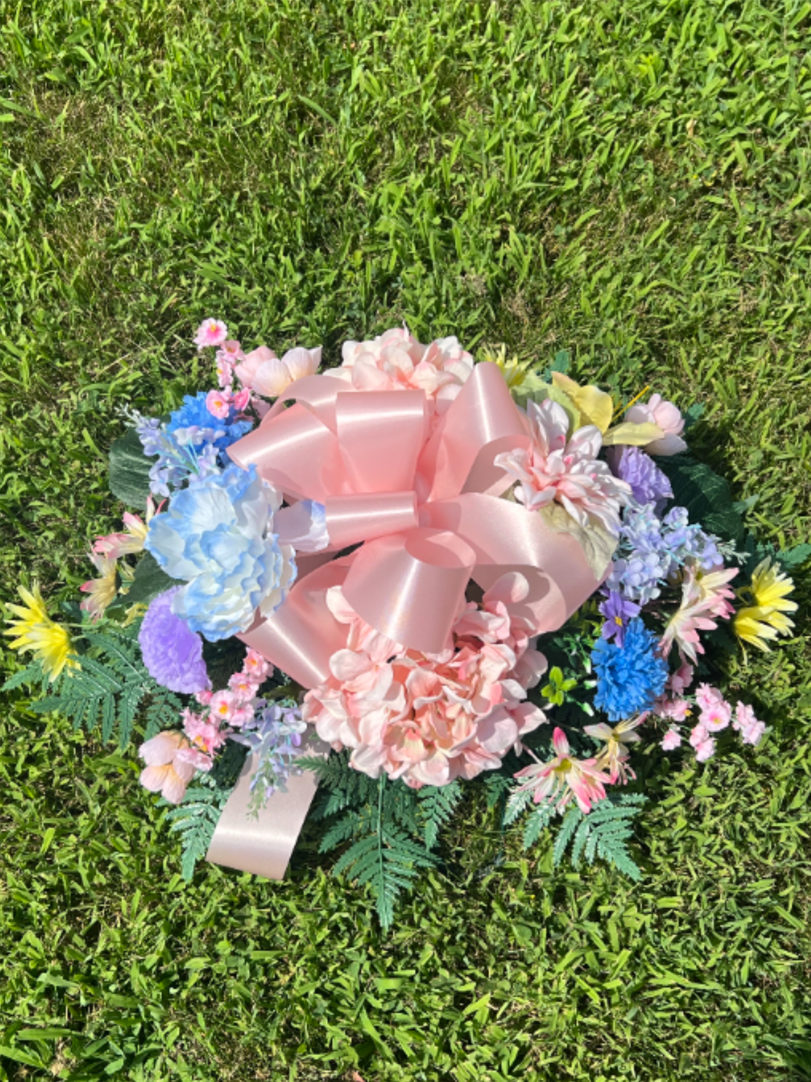 Pastel Silk Cemetery Saddle - Single - A combination of pastel silk flowers arranged in a cemetery saddle. The saddle can be laid overtop a grave plot or mounted on a single sized headstone. If you have any specific requests, please put them in the notes.