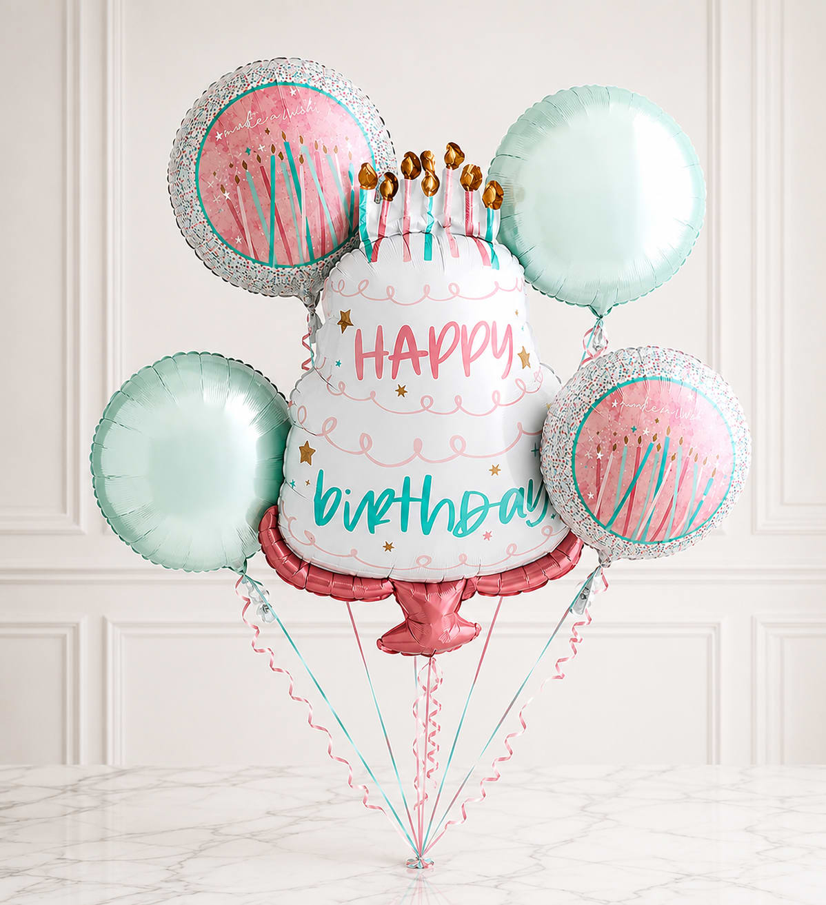 Pastel Birthday Balloon Bouquet™ - Celebrate in sweet style with the Pastel Birthday Balloon Bouquet™. This festive balloon arrangement features a large birthday cake-shaped foil balloon surrounded by coordinating pastel balloons in soft pink and mint green, creating a fun and elegant display. Perfect for birthdays of all ages, this bouquet adds a cheerful touch to homes, offices, parties, hospitals, or any birthday celebration. Delivered inflated and ready to enjoy, it's a memorable gift that brings smiles instantly.