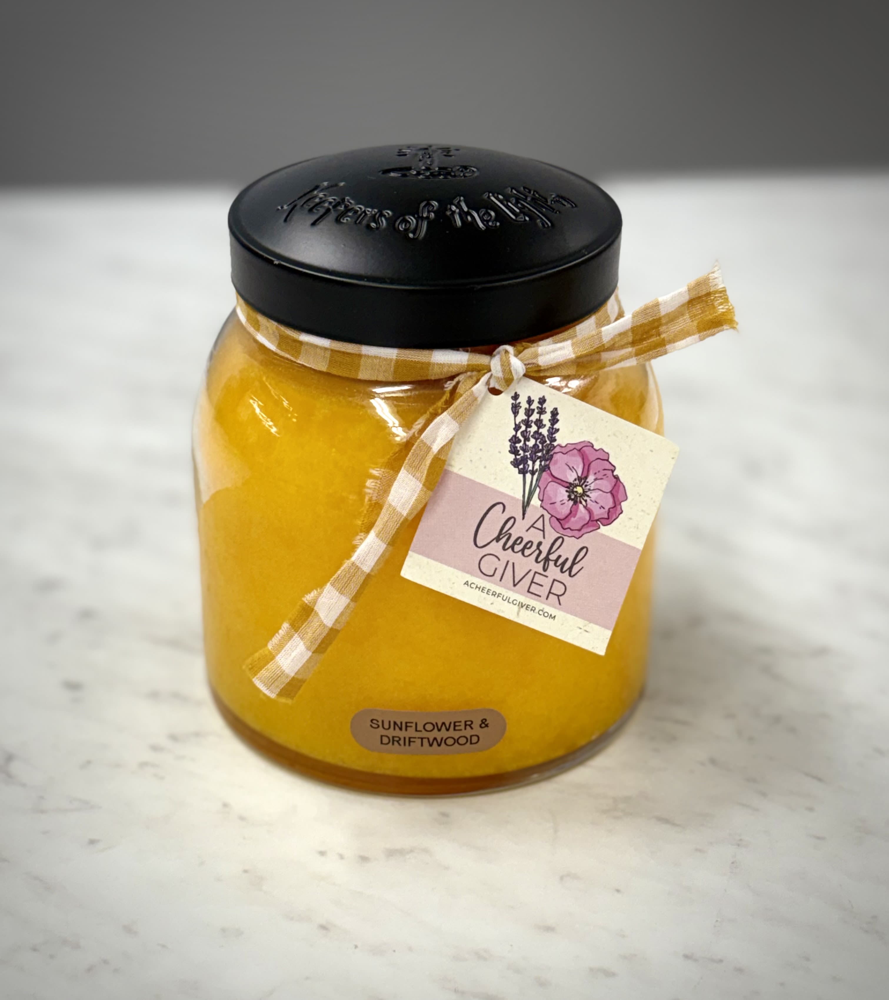 34 Oz Jar Candle - Sunflower and Driftwood - 34 oz Jar Candle: burns for approx. 155 hours.  Cheerful Giver "Keepers of the Light" series  Scent: Sunflower and Driftwood