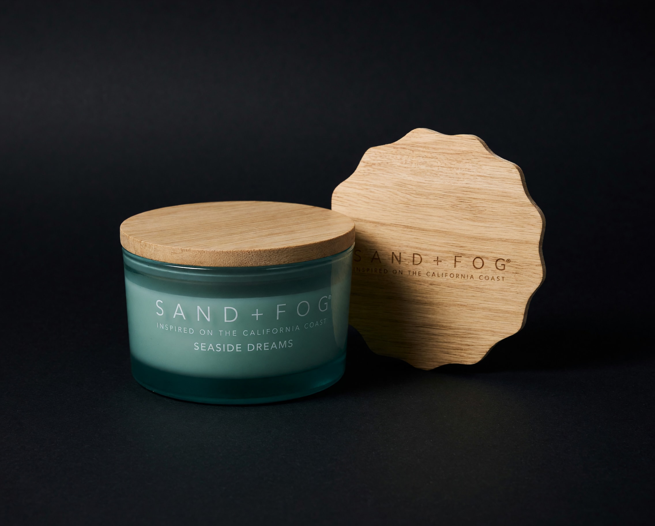 Sand &amp; Fog Seaside Deams Elegant Ceramic Candle - Create a warm and inviting atmosphere with our beautifully crafted ceramic candle. Poured with premium wax and housed in a stylish reusable ceramic vessel, this candle adds a touch of elegance to any home. A wonderful gift on its own or the perfect complement to a fresh floral arrangement for birthdays, holidays, housewarmings, sympathy, or simply because.
