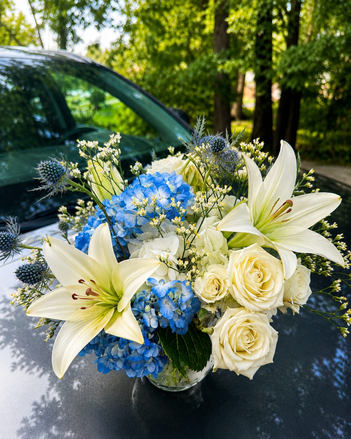 Blue &amp; White Elegance Arrangement  - Blue &amp; White Elegance Arrangement  Looking for a timeless floral arrangement that makes a lasting impression? Our Blue &amp; White Elegance Arrangement combines crisp white lilies, premium white roses, vibrant blue hydrangeas, and seasonal accent flowers in a clear glass vase. This handcrafted design brings sophistication, beauty, and freshness to any occasion.  Perfect for birthdays, anniversaries, sympathy, celebrations, thank-you gifts, or simply brightening someone’s day, this arrangement is designed with premium blooms and attention to every detail.  Features:  * Fresh white lilies * Premium white roses * Blue hydrangeas * Seasonal accent flowers * Handcrafted in a clear glass vase  Same-day flower delivery available in Alpharetta, Johns Creek, and surrounding North Atlanta communities.  Order today and let us help you make every moment unforgettable with fresh, handcrafted flowers.  AZ Flowers &amp; Gifts – Beautiful flowers for every occasion.