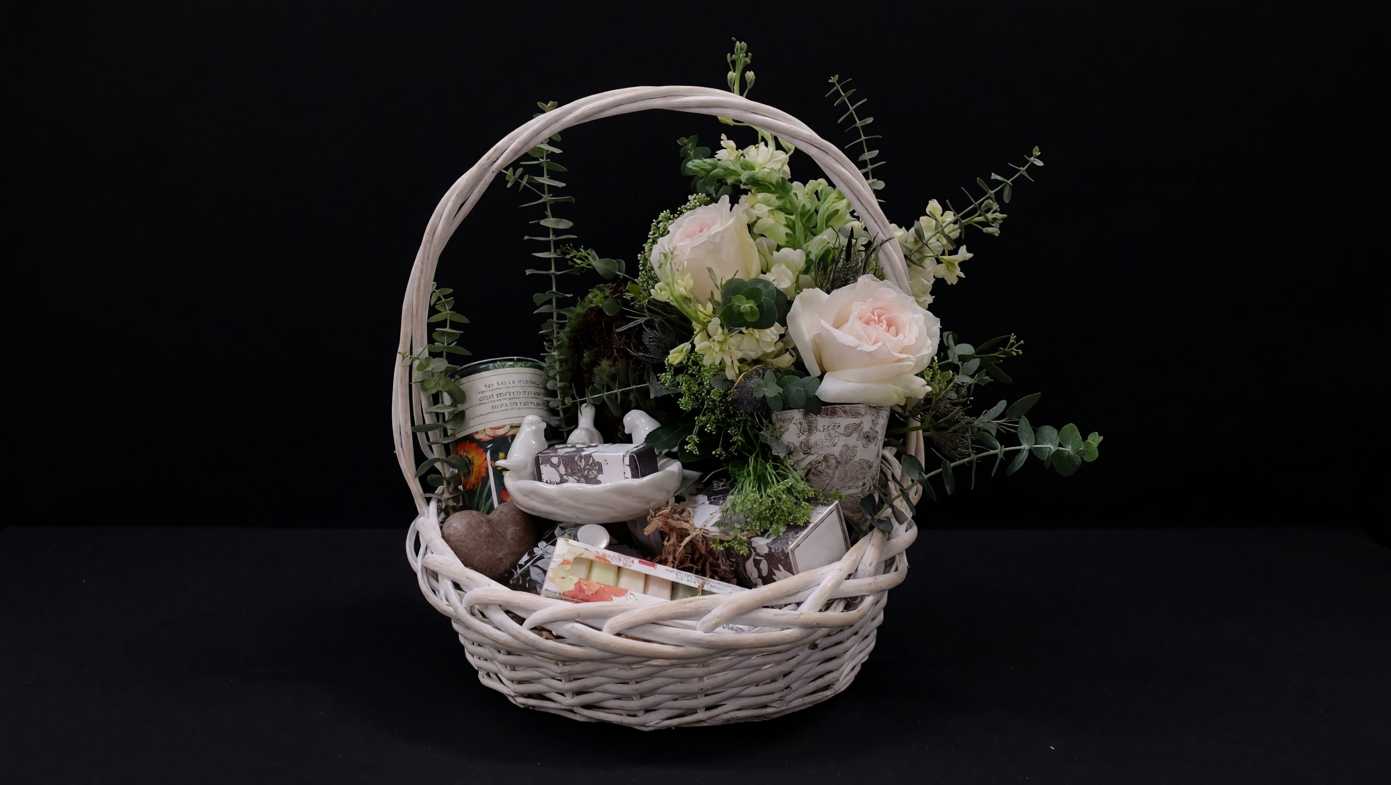Garden Escape Gift Basket - A beautifully curated gift basket featuring fresh flowers, candles, bath and body essentials, and thoughtful gifts. Customize the contents to create a luxurious gift for birthdays, anniversaries, Mother's Day, or any special occasion.