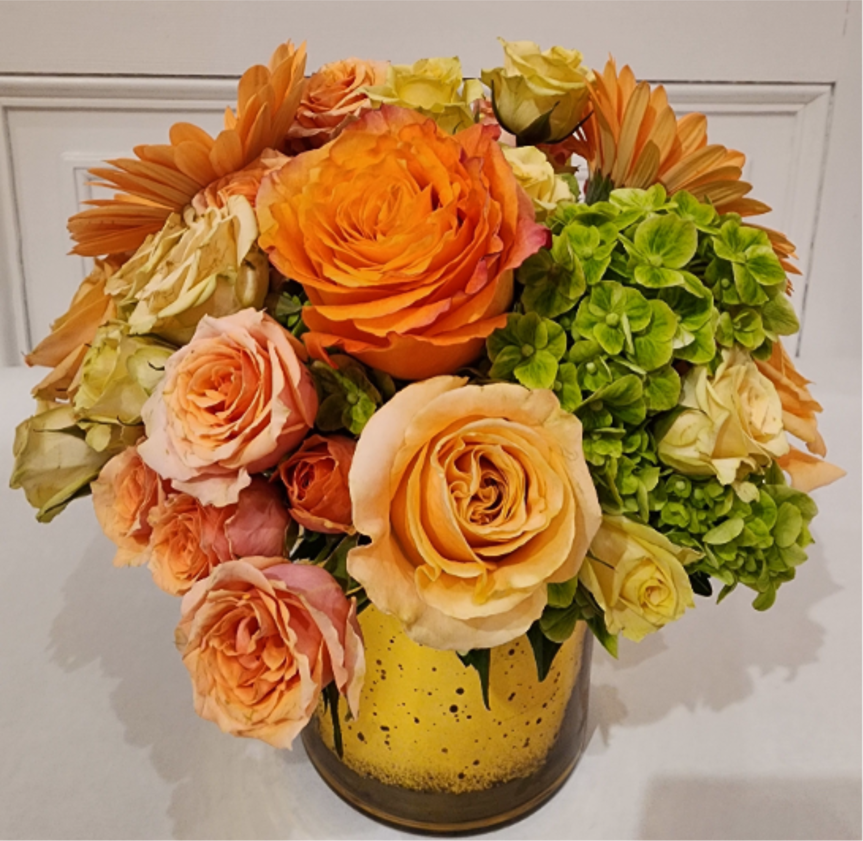 "Miesner Citrus Spritz" Bouquet - A refreshing display of coral, peaches, and lime green flowers evokes the memory of one of the season's most popular libations. Perfect for a friend who lunches, or even for yourself for a pick-me-up. You'll be sure to order this one again and again!