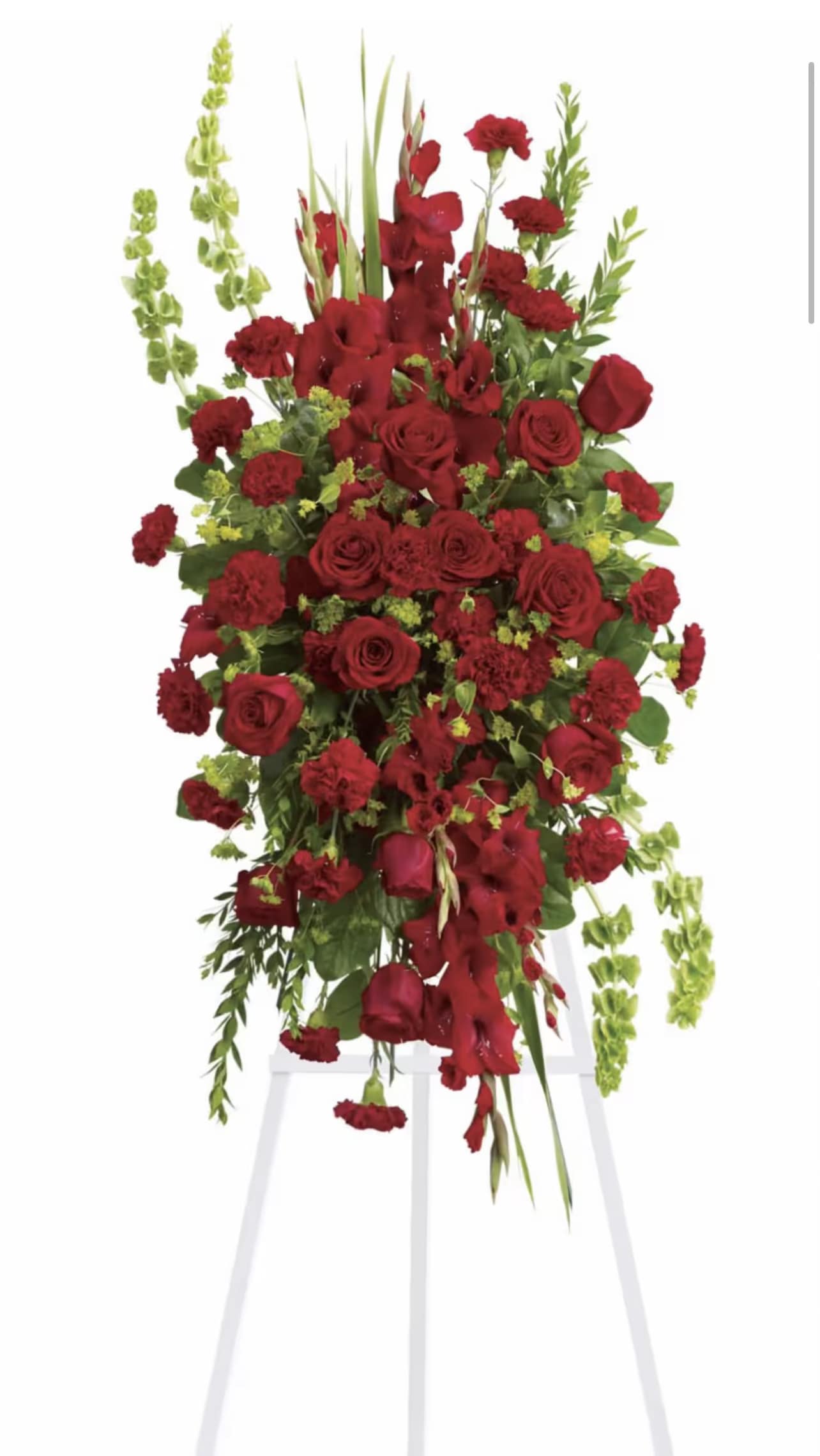Tall red floral spray on a white easel