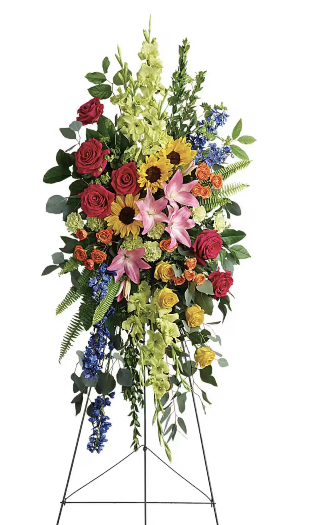 Tall standing floral spray with roses, lilies, sunflowers, and blue accents