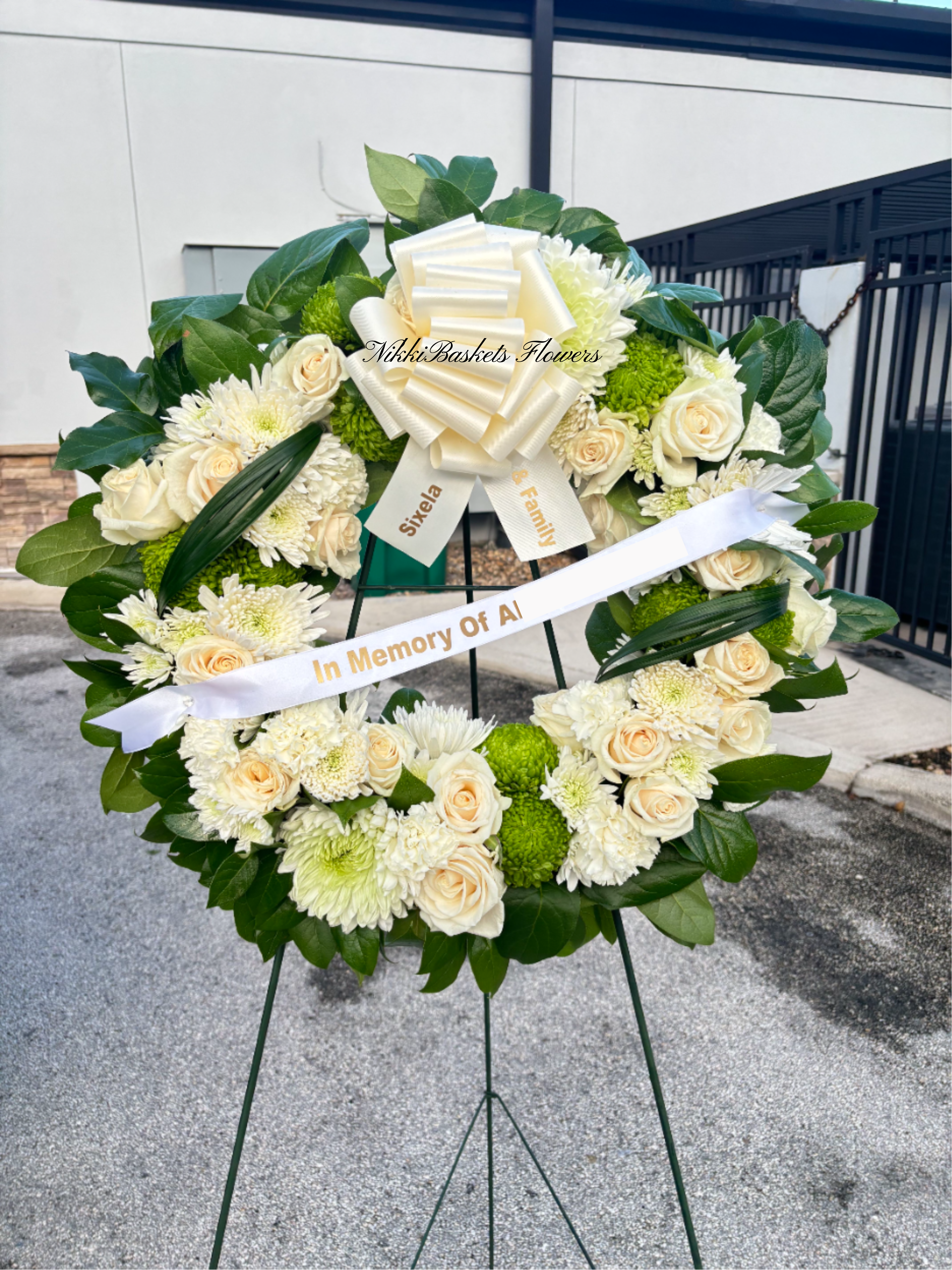 Elegant White &amp; Green Sympathy Wreath With Bow And Custom Ribbon - Elegant White &amp; Green Sympathy Wreath  A beautiful expression of love, peace, and remembrance. This Elegant White &amp; Green Sympathy Wreath features soft white roses, fresh chrysanthemums, and lush green accents carefully arranged in a circular design symbolizing eternal life. Adorned with a classic ivory bow and customizable ribbon message, it offers a heartfelt way to honor and celebrate the memory of a loved one.  Perfect for: Funerals, memorial services, or to send condolences and comfort to grieving families. Customization: Add a personalized ribbon message to express your sentiments.