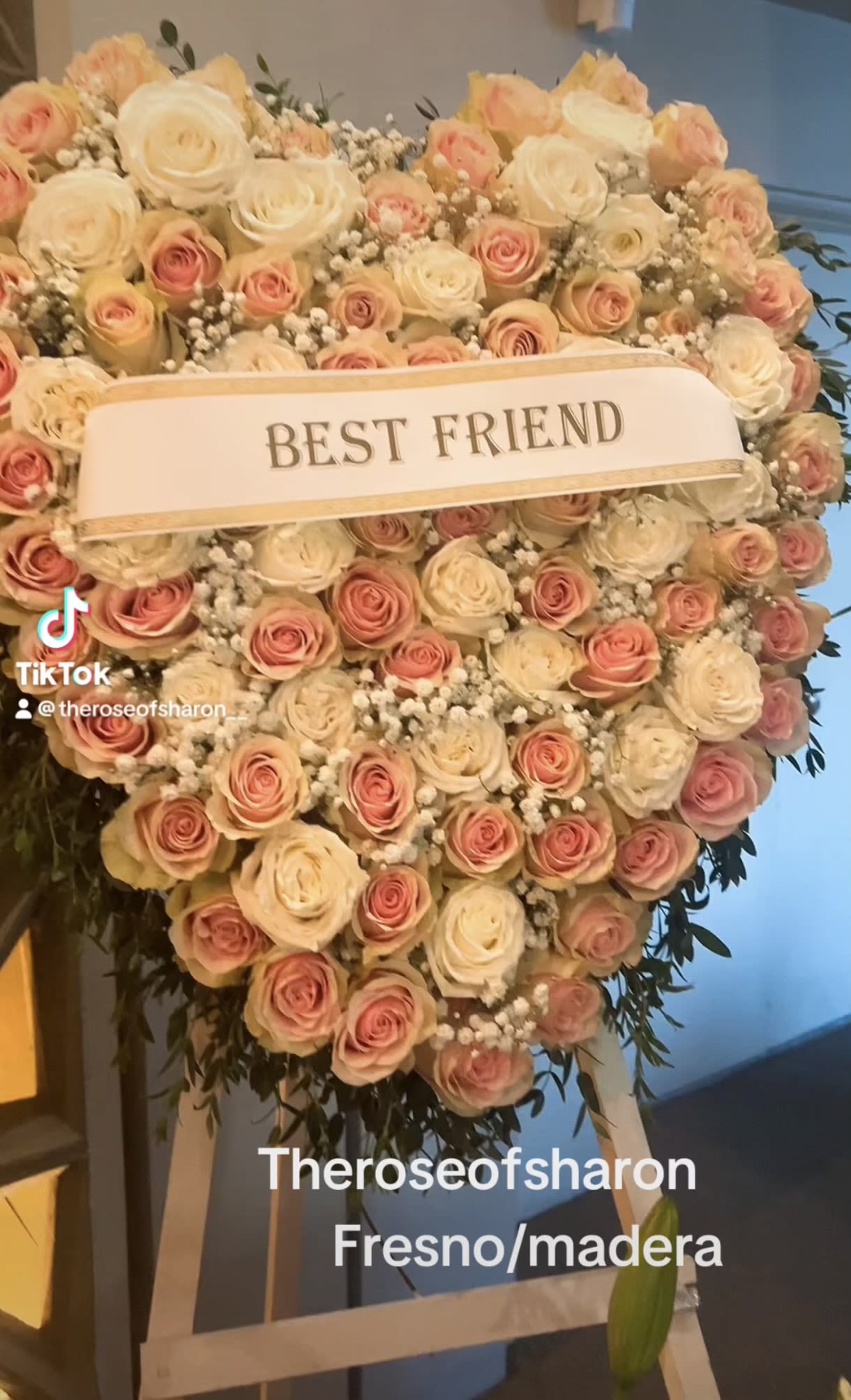 Heart-shaped rose arrangement with a "BEST FRIEND" ribbon
