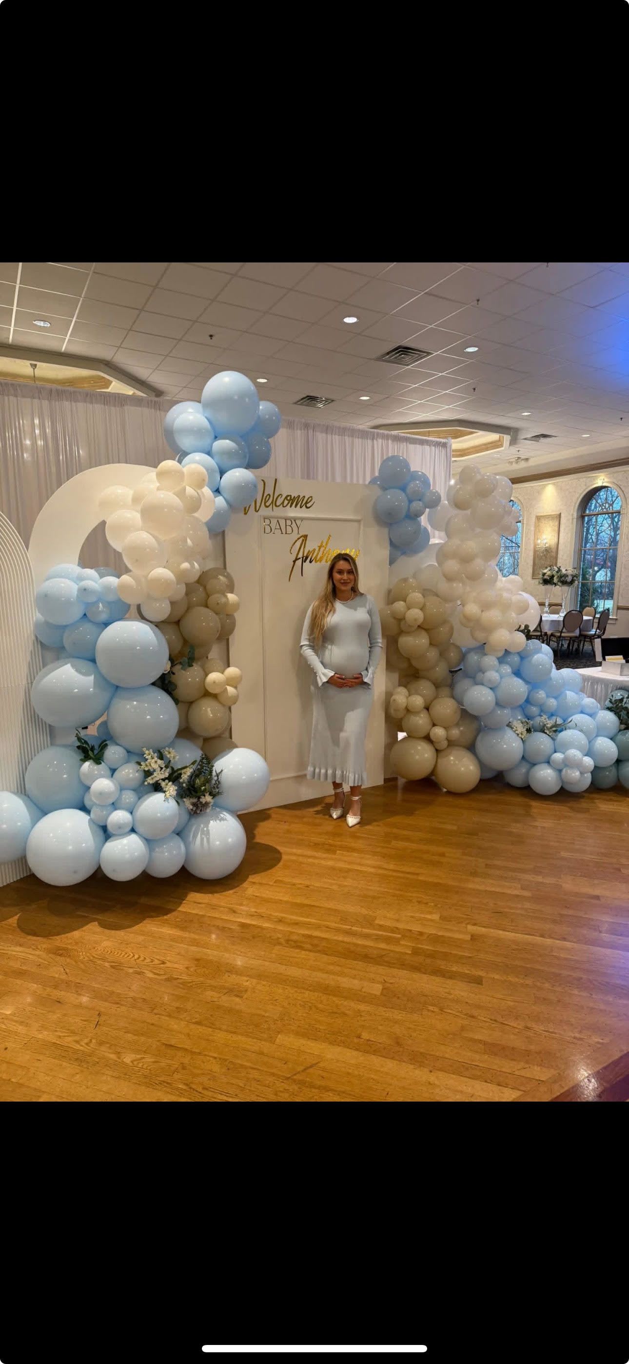 Baby Shower in Blue Backdrop  - 4 wooden backdrops with 2 double balloon garlands, 2 single balloon garlands, custom vinyl letters. White draping is additional. Delivery and set up is additional and based on the location of your event. 