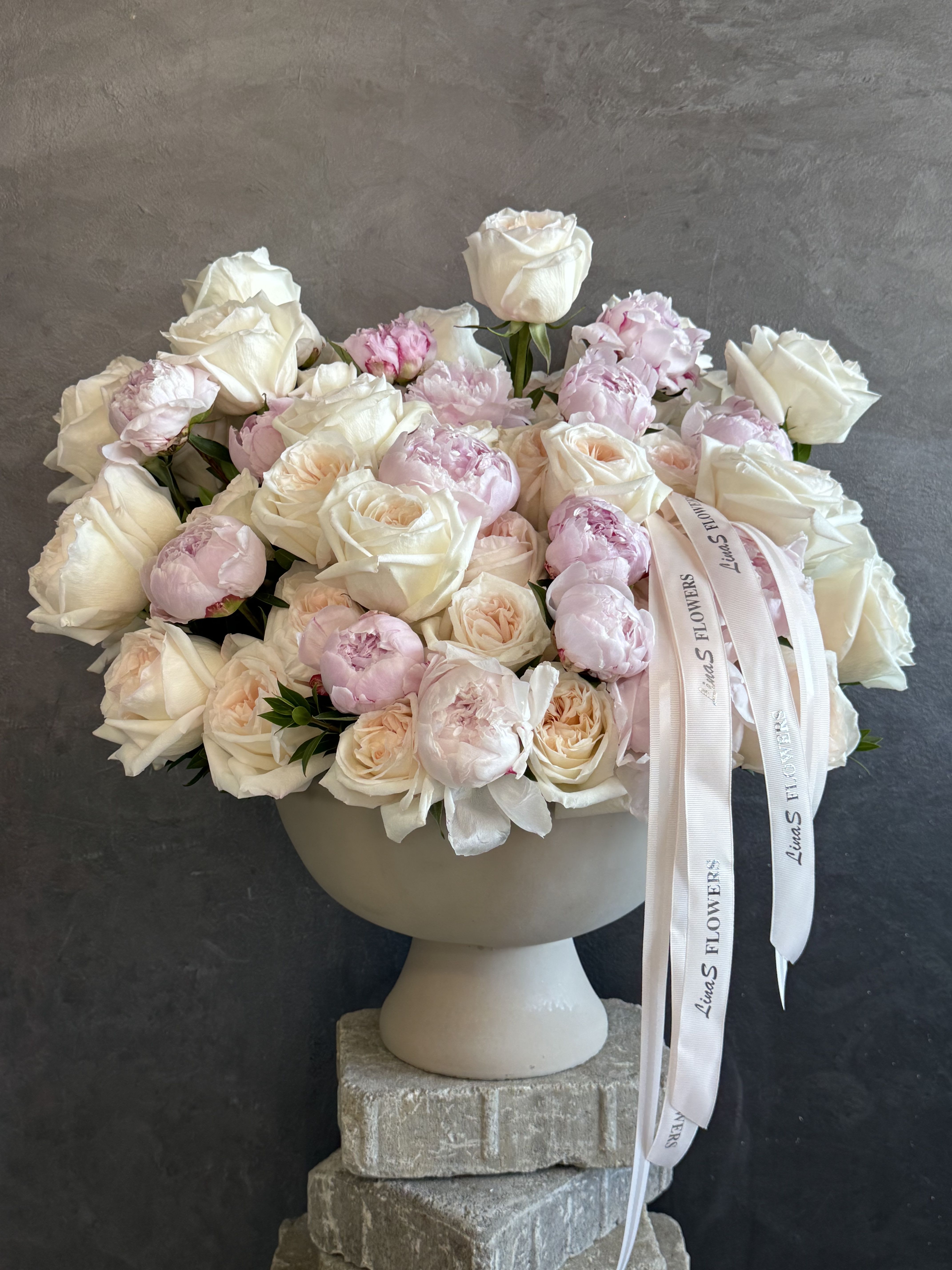 Viola - A timeless arrangement of premium white garden roses and soft blush peonies, artfully designed in a classic ceramic vase. Romantic, elegant, and perfect for birthdays, anniversaries, celebrations, or simply making someone’s day unforgettable.