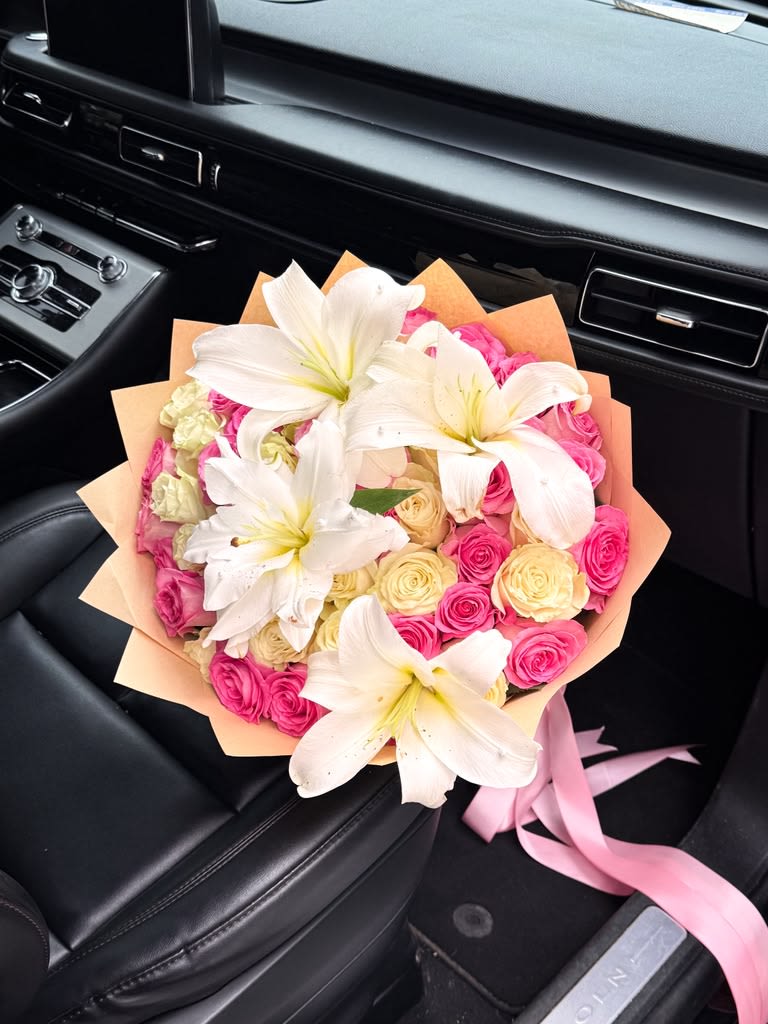 Royal Lily Garden Bouquet - Bold, elegant, and unforgettable. The Royal Lily Garden Bouquet combines fragrant white oriental lilies with premium pink and ivory roses, creating a luxurious arrangement that radiates beauty and sophistication. Expertly handcrafted and wrapped in premium Korean floral paper, this bouquet is perfect for birthdays, anniversaries, graduations, congratulations, Mother’s Day, or simply making someone’s day extraordinary.