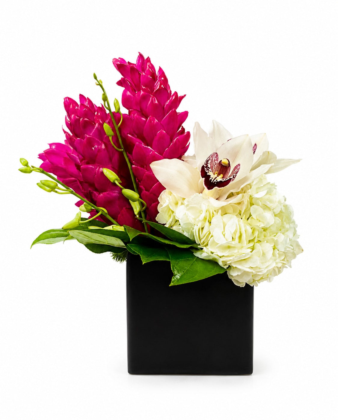 Pink and white flowers arranged in a black square vase