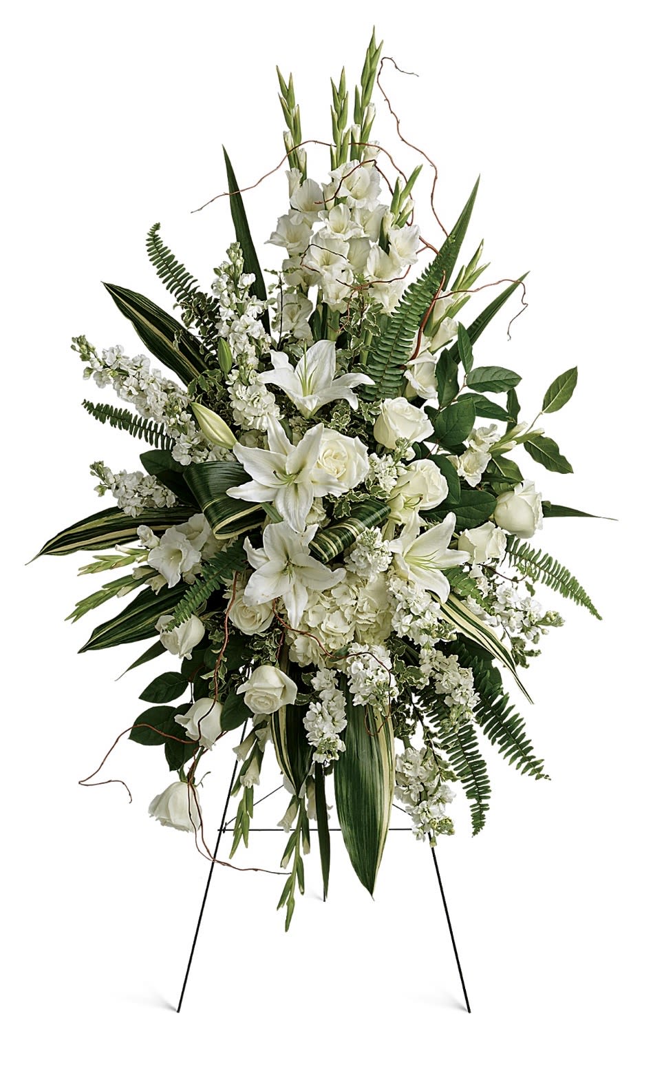 Heartfelt Sympathy Soray - A tall, sculptural standing spray that reads with quiet dignity - perfect as a sympathy arrangement or for a funeral service. The vertical design of white lilies, white roses, clustered white blooms and layered greenery creates a serene, formal statement that lets the person you're honoring feel remembered and respected.  Built to present on a metal easel, this service piece is dense and architectural: long leaves and curling twig accents add graceful height while the clustered blooms provide a soft, consoling texture. The all-white palette with fresh green accents keeps the focus on the sentiment; proportions and scale make it suitable as a focal tribute at a memorial or graveside service.  This arrangement is intended as a standing spray for services and arrives ready to display on the included easel. Its classic color story and refined silhouette offer a meaningful way to express sympathy and support when words are not enough.