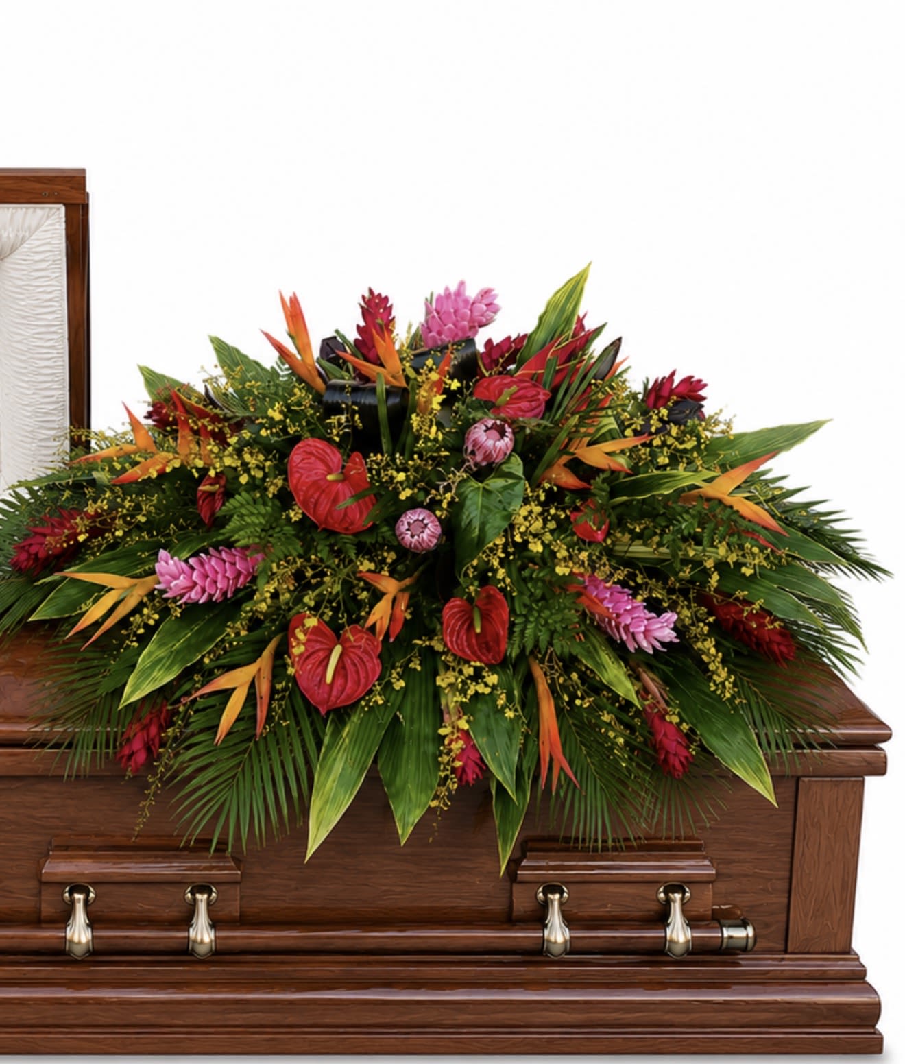 Tropical Splendor  - A lush, high-impact casket spray designed to honor and celebrate a life with bold tropical flair - perfect as a sympathy arrangement for a funeral or memorial service. This large, low casket spray places tropical arrangement and condolence tribute front and center, offering a vivid, ceremonial display that will make the person you're remembering feel deeply respected and cherished.  Bright red, pink, and yellow tropical blooms are densely layered among broad palm-like foliage and long pointed leaves to create a dramatic, formal composition. The saturated colors and full, low profile spread give the arrangement a sculpted, textured look that reads well from the front of a silver casket and fills the space with color and presence. Finished to sit across the casket, the piece emphasizes tropical flowers and plentiful greenery for a rich, ceremonial statement.  Made to convey sympathy and honor, this spray is ideal for family members, close friends, or as a meaningful tribute from an organization. Because it's constructed as a traditional casket spray, sizing and placement are handled by our team to ensure a secure, appropriate fit; contact us with service details so we can coordinate delivery and placement for the memorial.