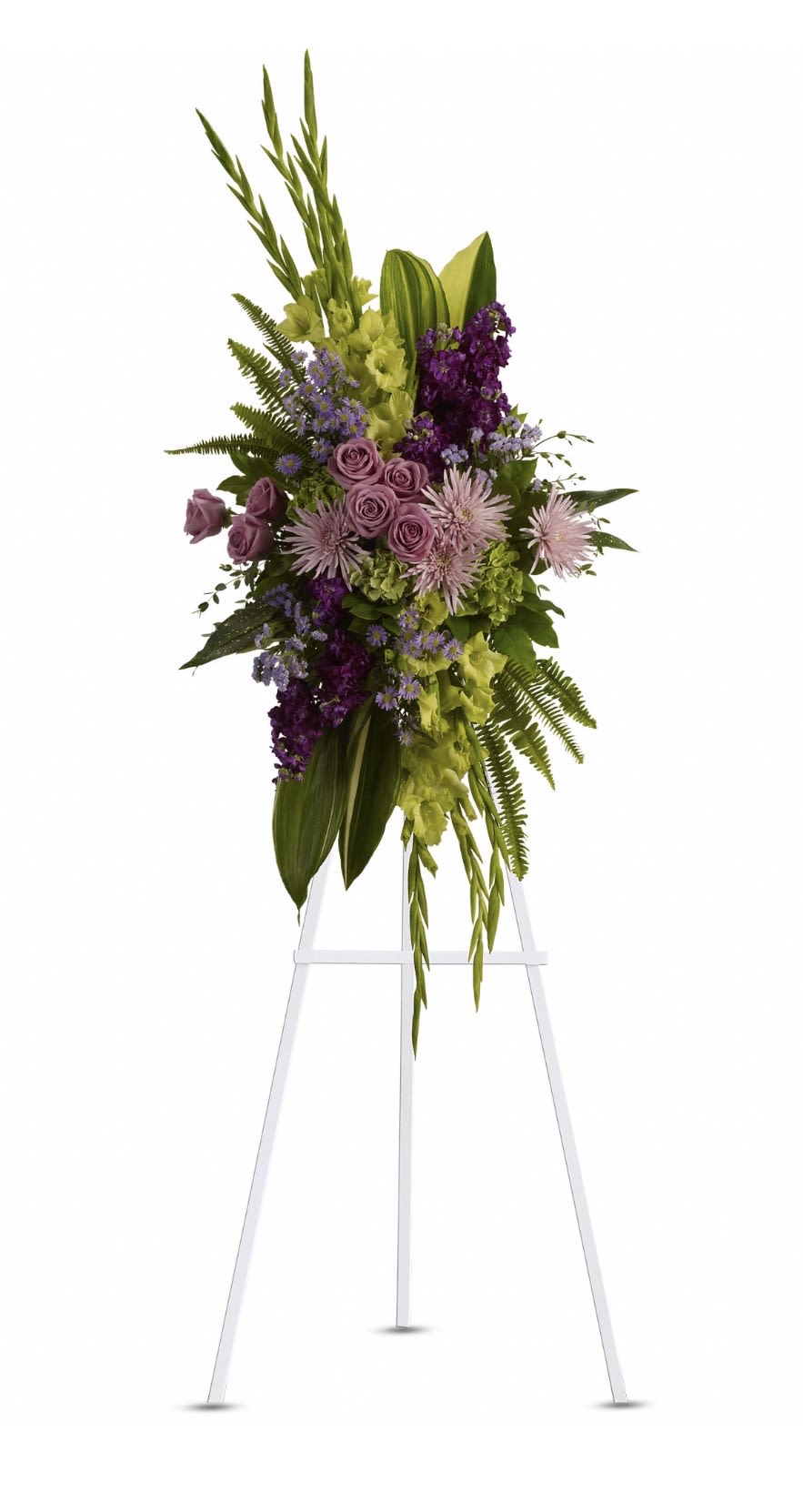 The Endless Sky Spray - A tall, elegant standing spray that reads like a quiet sky at dusk-lavender roses and deep purple blooms rise in layered vertical lines to create a serene sympathy arrangement for a funeral or memorial service. The product type (standing spray) and occasion (sympathy and funeral) are present in the design from the first glance, giving the person you're honoring a composed, dignified tribute that feels both modern and timeless.  This arrangement pairs soft lavender roses with chrysanthemum and pale pink daisy-like asters, accented by lime-green blooms and snapdragons for vertical motion. Long sword-like leaves and delicate fern fronds provide structure and height, forming a dense, upright composition mounted on a white easel for formal presentation. The cool palette-purple, lavender, green, pink, and white-creates a slightly dramatic yet peaceful impression appropriate for remembrance.  Made to stand beside a casket or at the front of a service, this spray offers a respectful way to express sympathy and support; it reads as both comforting and refined, so the recipient will feel truly remembered. Order with any special delivery instructions for placement at the service; care is handled by the shop to ensure the arrangement arrives fresh and ready on its easel.