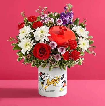 Disney Mickey Mouse &amp; Friends Cookie Jar - Romance - Share the love this Valentine’s Day with a gift full of character(s)! Part of our exclusive Disney collection, this handcrafted bouquet is gathered in radiant colors and designed in our whimsical Mickey Mouse and Friends cookie jar, featuring iconic animations of the whole gang. Great as a keepsake container or to keep delicious treats, it’s a sweet and nostalgic surprise for someone special.