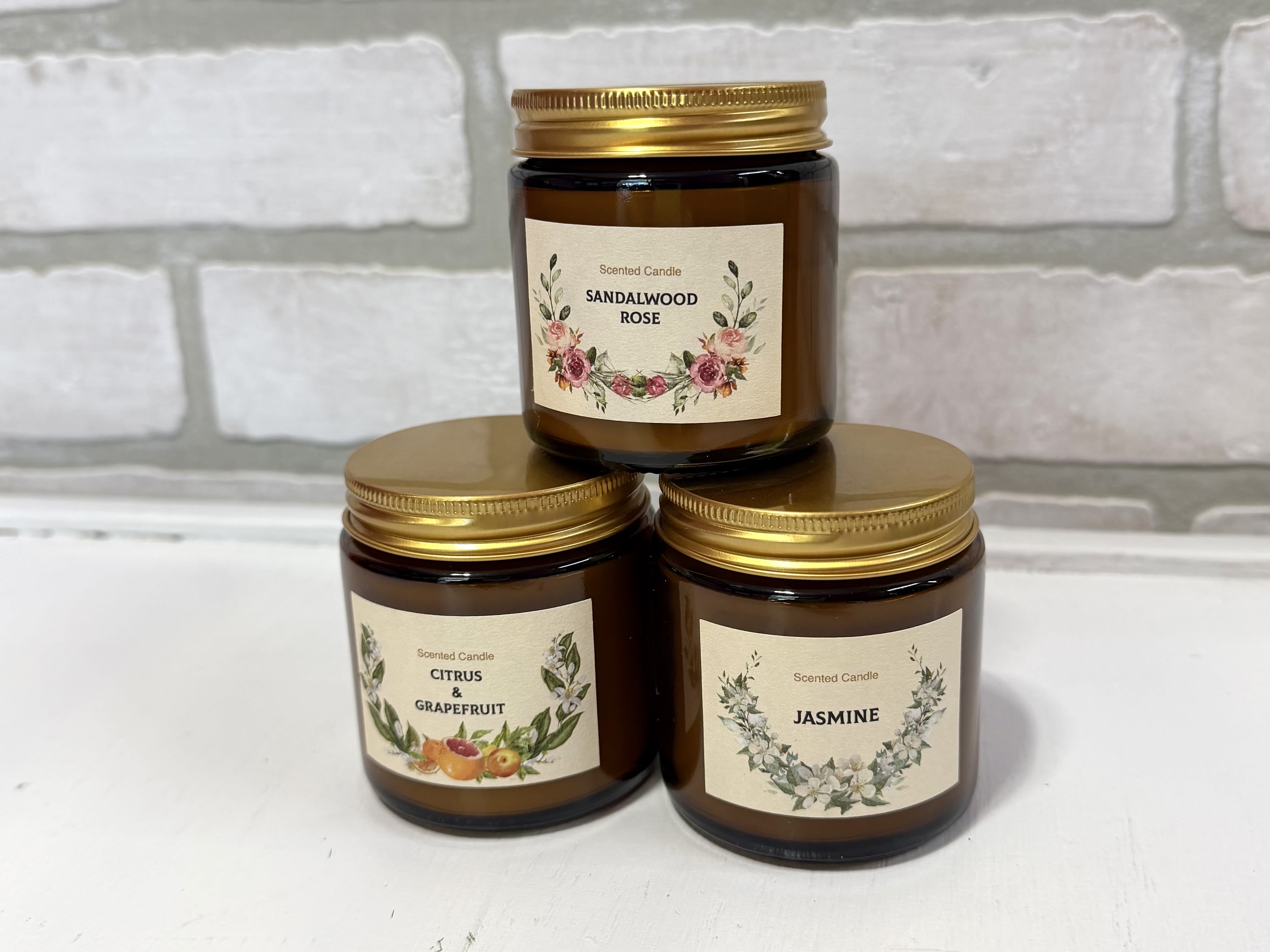 All Natural Soy Candles - Amber candle jars with gold lids and printed labels, assorted scents.   *Scents May Vary.*