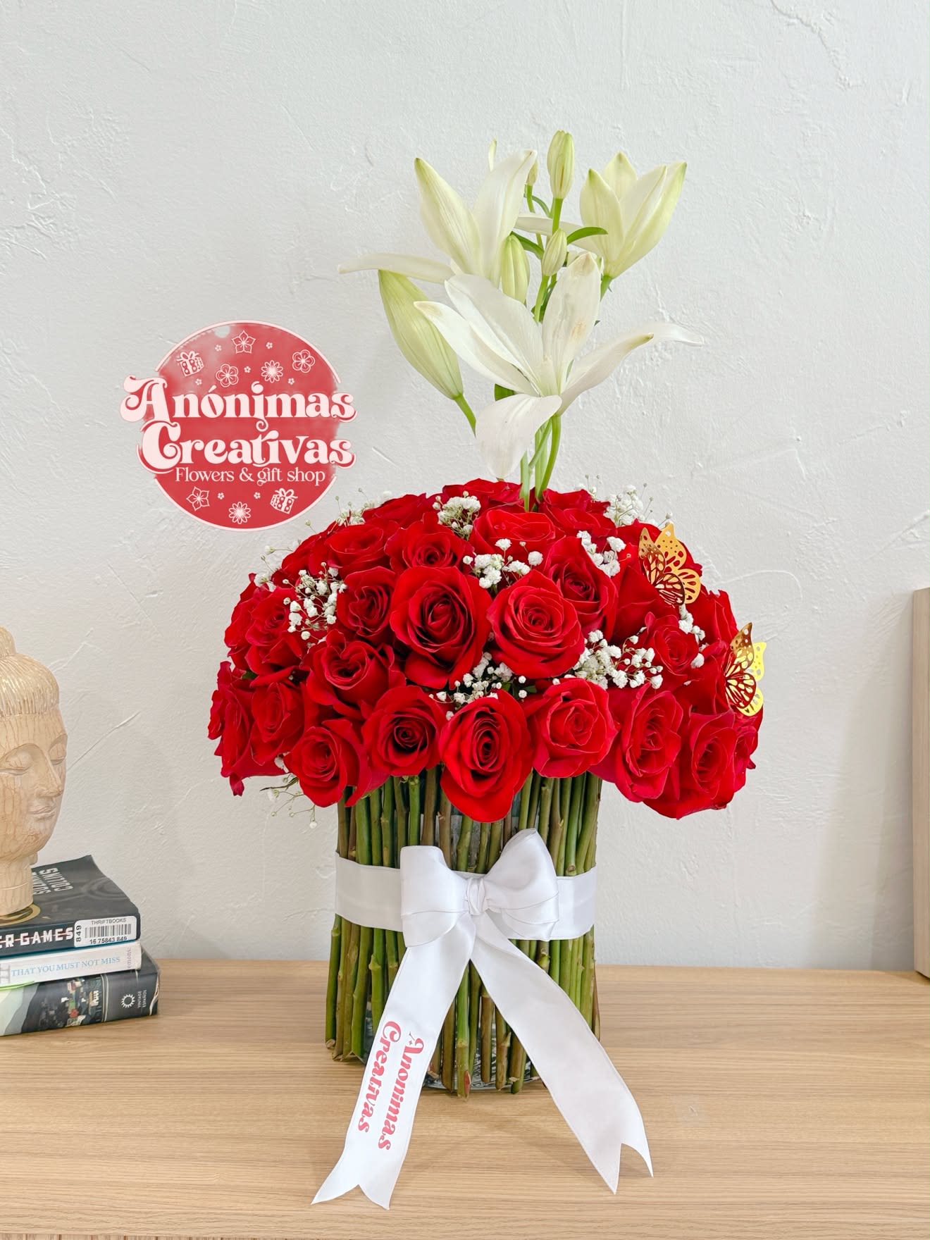 55 Red Roses &amp; White Lilies Luxury Arrangement -  Perfect for anniversaries, birthdays, romantic surprises, Valentine’s Day, proposals, or any occasion when only an extraordinary gift will do.  Each arrangement is handcrafted by our expert florists using the freshest flowers available. Flower varieties may vary slightly depending on seasonal availability while preserving the overall style, color, and premium presentation.  Perfect For:  * Anniversary Gifts * Romantic Occasions * Valentine’s Day * Birthday Celebrations * Proposals * Congratulations * Luxury Floral Gifts  Features:  * 55 premium long-stem red roses * Elegant white lilies * Delicate baby’s breath accents * Modern stem-wrapped design * Finished with a luxurious satin ribbon * Handcrafted by expert florists * Same-day flower delivery available in Miami 