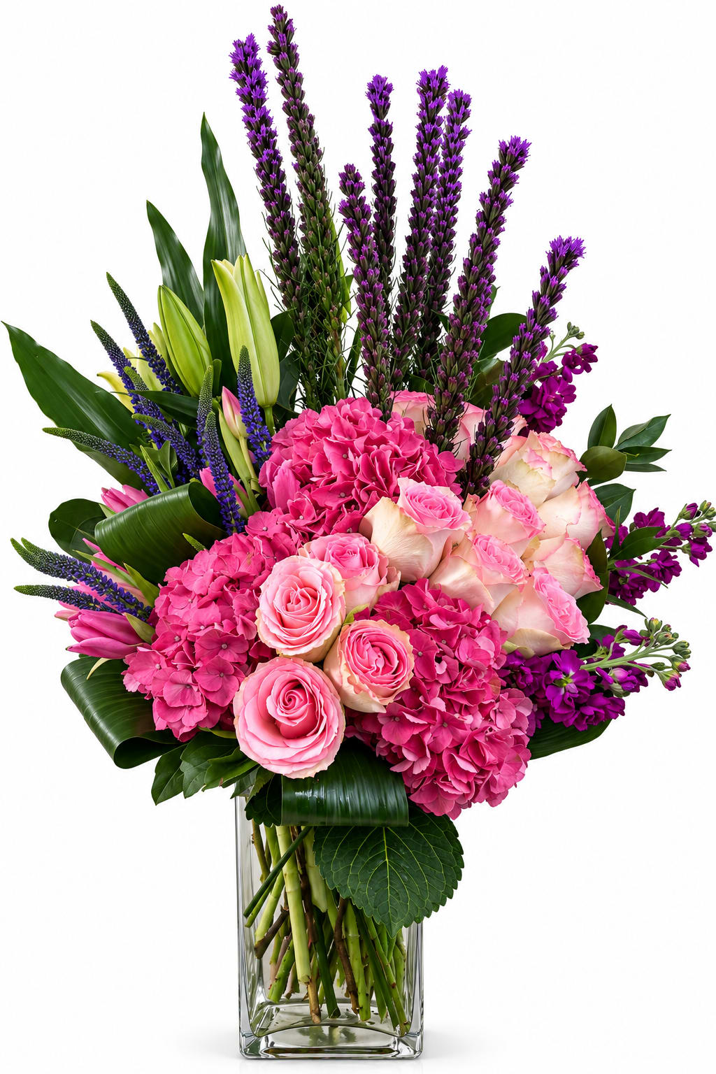 Radiant Garden  - A luxurious arrangement featuring vibrant pink hydrangeas, soft blush roses, elegant lilies, and striking purple liatris, artfully accented with lush greenery. Designed in a sleek glass vase, this breathtaking bouquet offers the perfect blend of texture, color, and sophistication. An ideal gift for birthdays, anniversaries, congratulations, or any occasion that calls for a beautiful expression of love and appreciation.