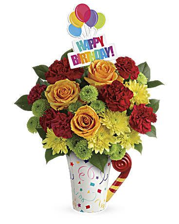 Birthday bouquet with roses, carnations, and balloons in a decorated vase