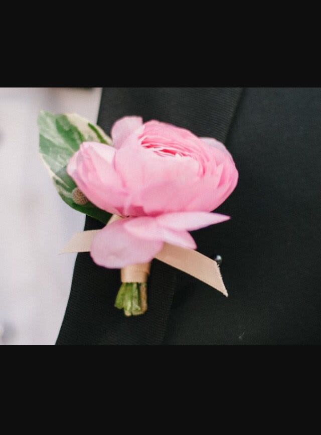 Pink boutonniere with a ribbon tie
