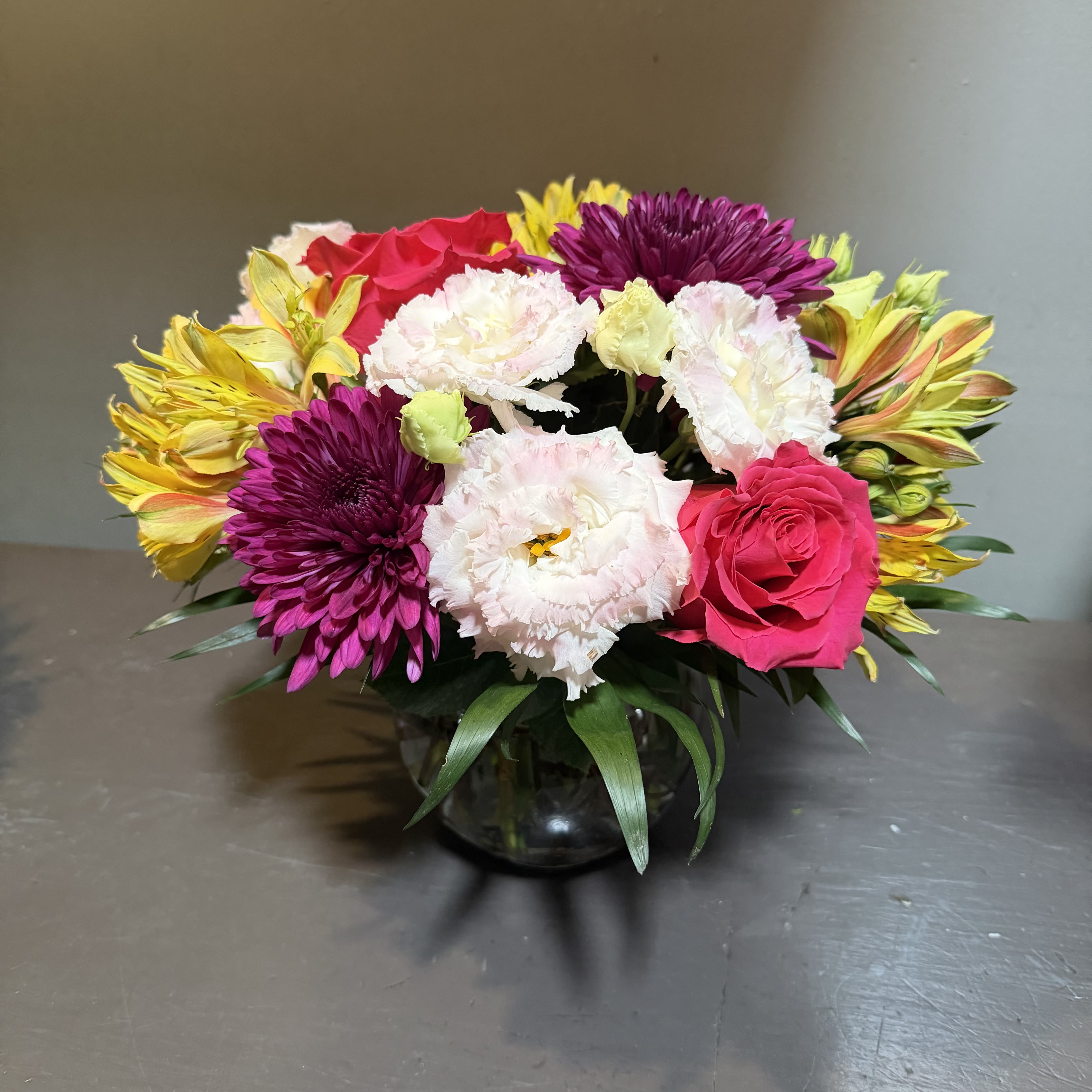 Mod Mood - A modern arrangement designed with cheerful summer flowers. Measures approx. 13"Tx12"W and arrives in a glass bowl.