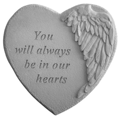 Heart-shaped memorial plaque with angel wings and engraved text