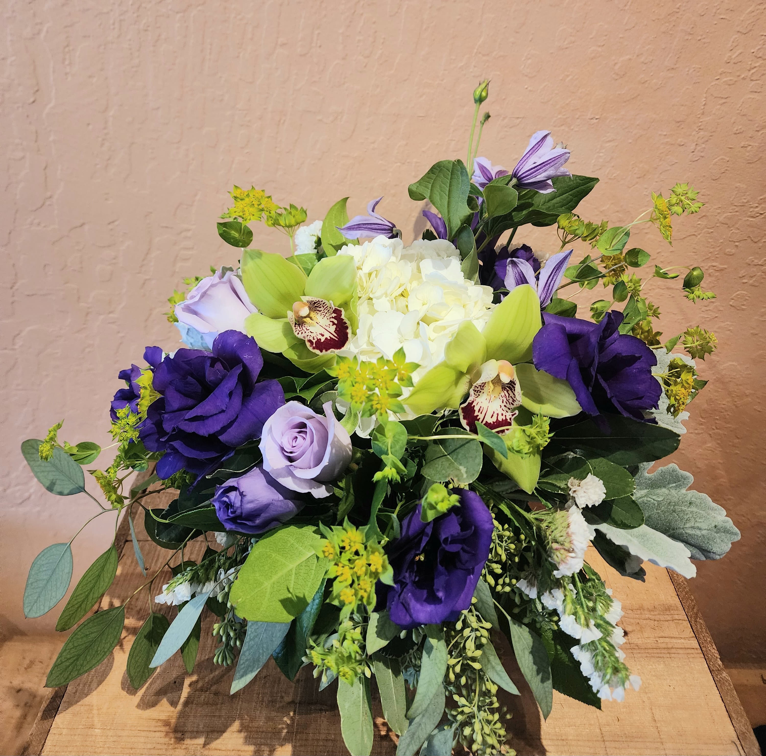 Purple Prince  - Green orchids and purple blossoms make an incredible combination. Cheerful design low and lush.