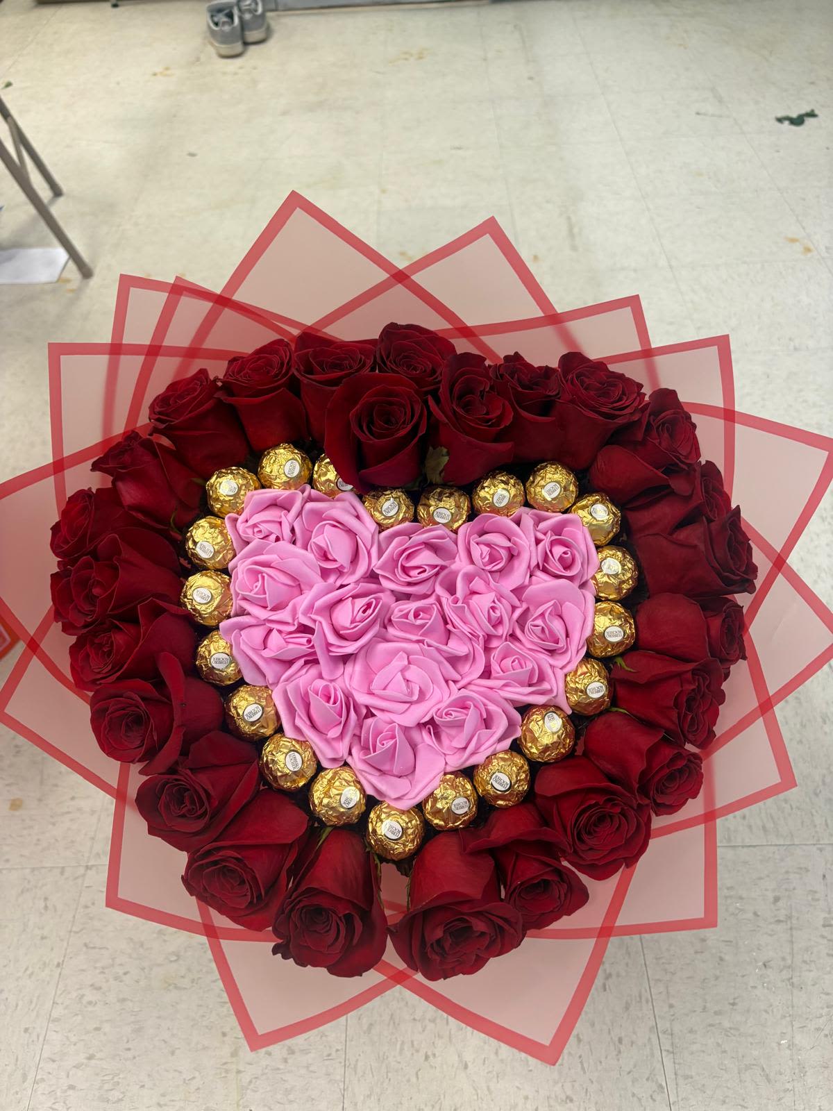 Heart artificial and natural red roses - Red natural roses around the artificial bouquet 