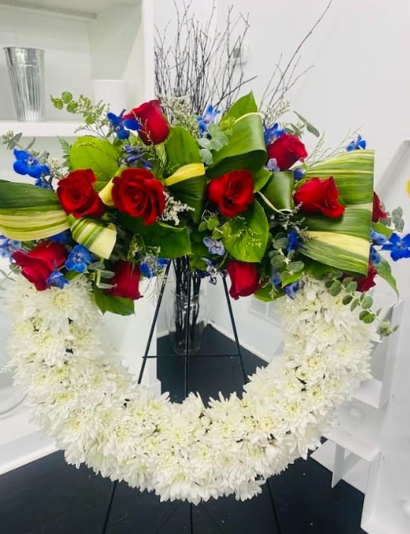 American Soul  - A perfect way to honor their beliefs and actions, this red, white, and blue wreath is a tribute to those who loved their country.   **Same Day- Please call to check for availability. 