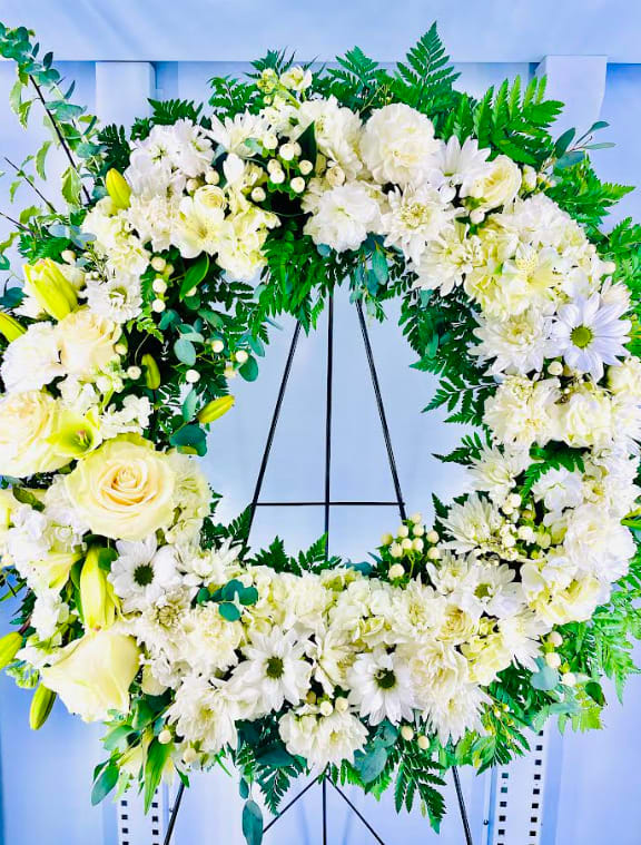 Lasting Serenity  - A beautiful white and green tribute wreath that calms, this easel arrangement celebrates a full life and a peaceful passing.   **Same Day- Please call to check for availability. 