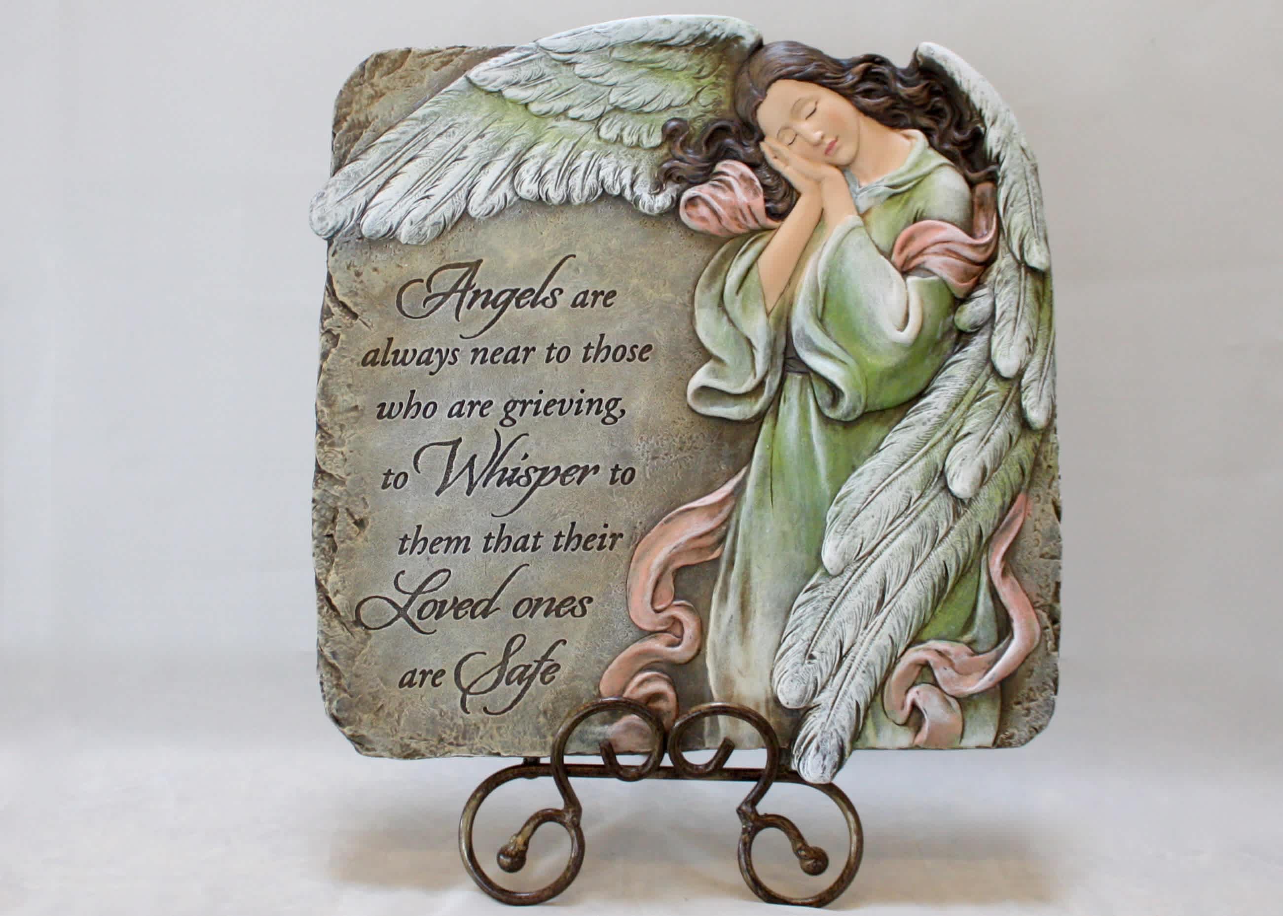 Decorative memorial plaque with a sleeping angel and sympathy message