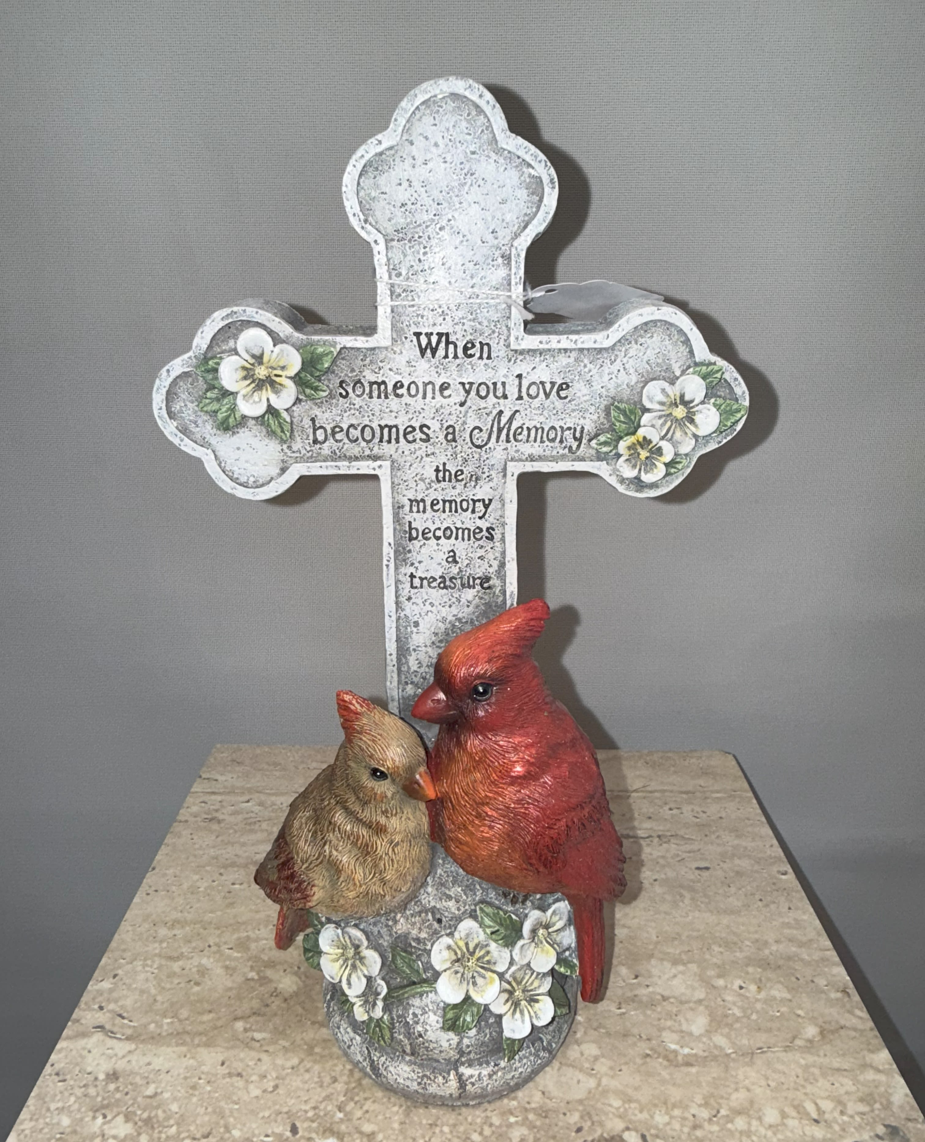Decorative cross with a cardinal figurine and memorial text